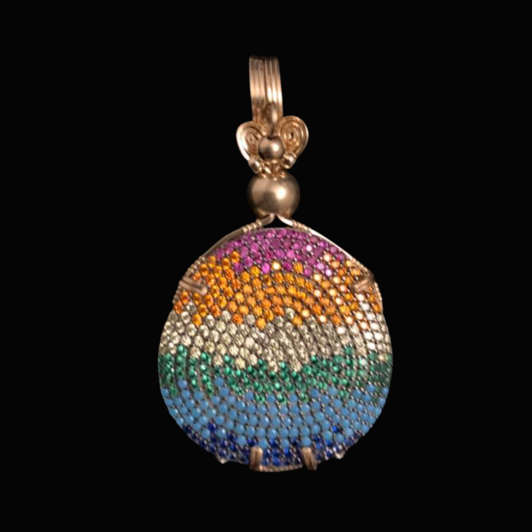 A colorful, beaded pendant featuring a rainbow design with pink, orange, white, green, blue, and purple beads, set against a black background.