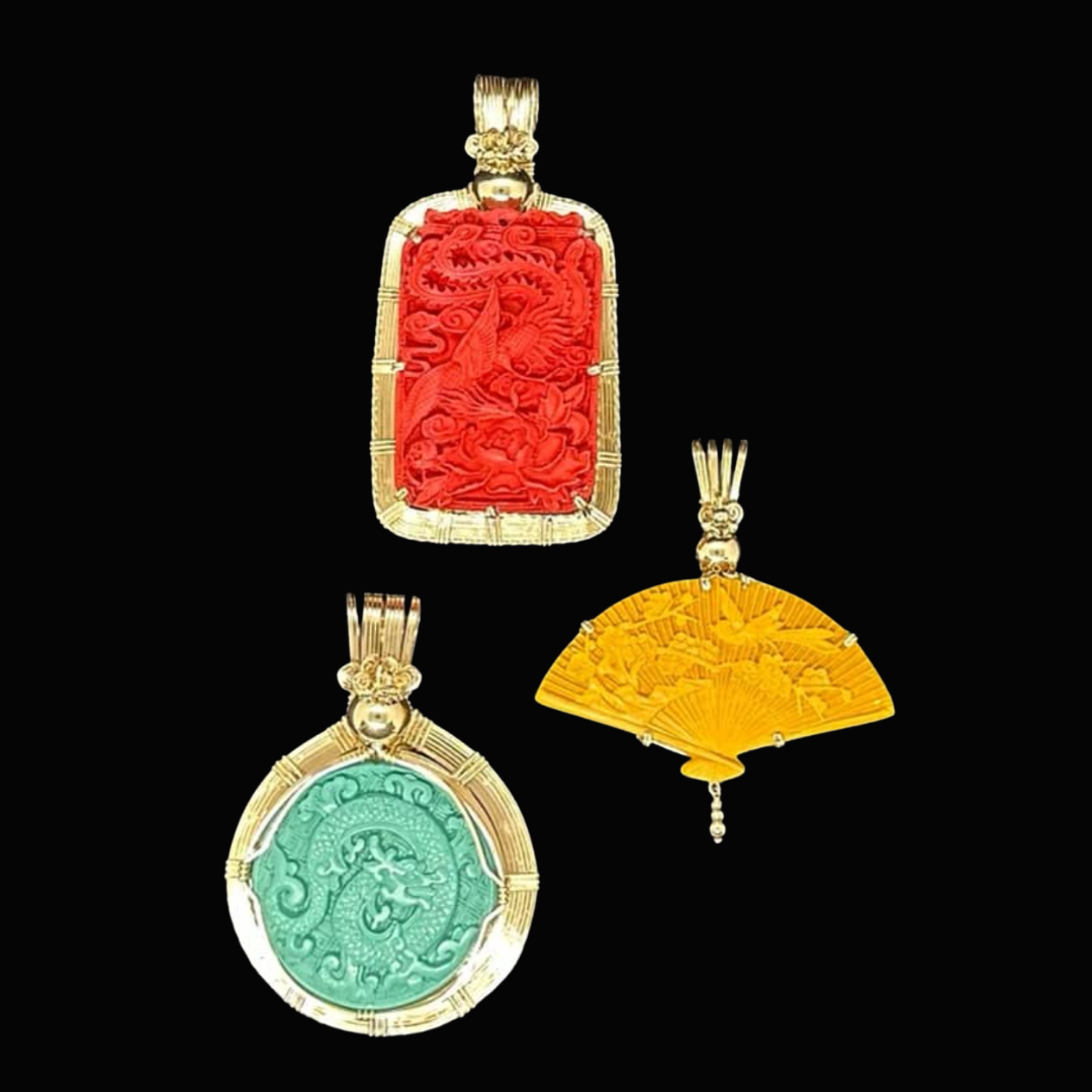 Three decorative pendants with Asian motifs and designs, including a dragon, landscape scene, and floral pattern, on a black background.