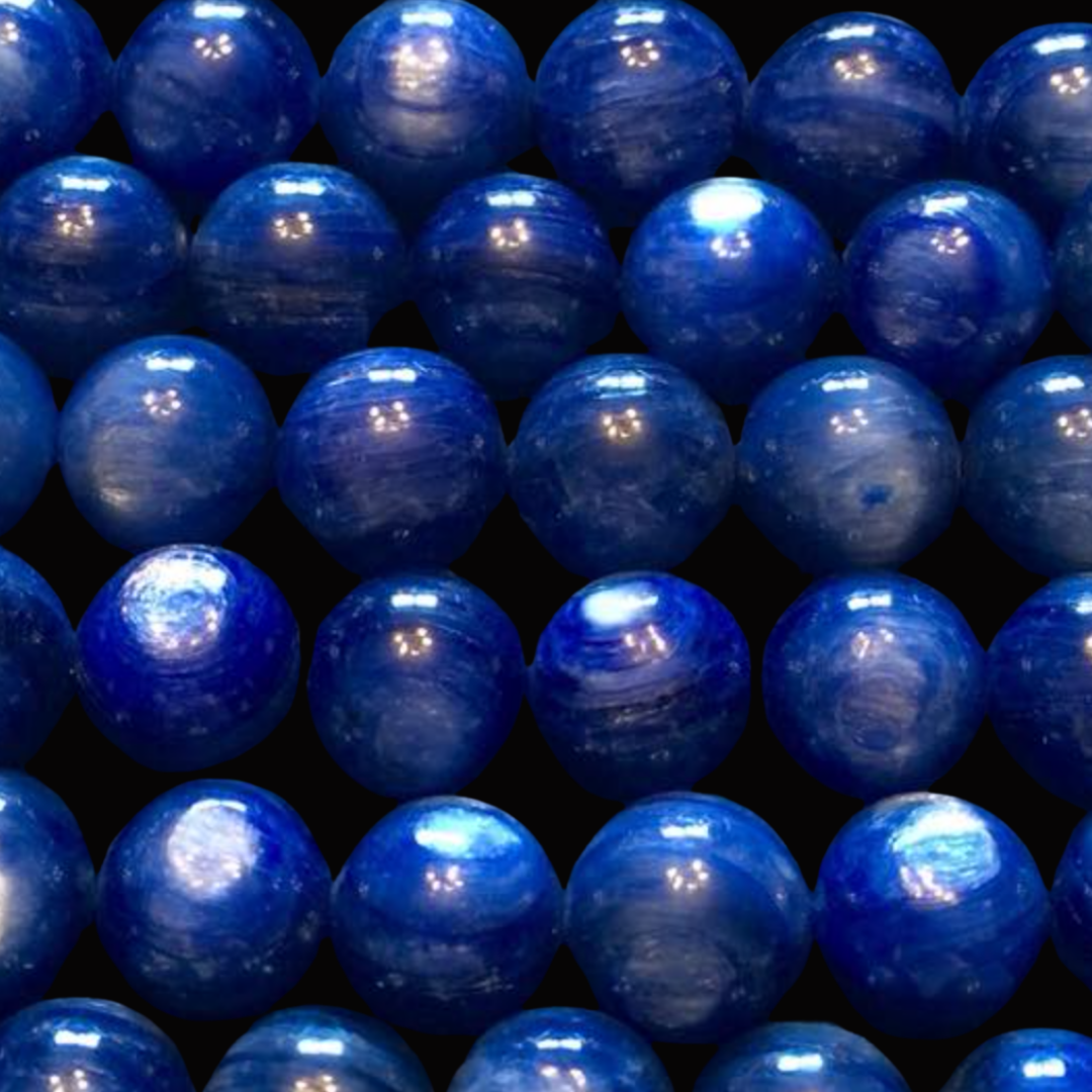 Close-up of multiple blue marbles with a glossy surface, arranged in a grid pattern.