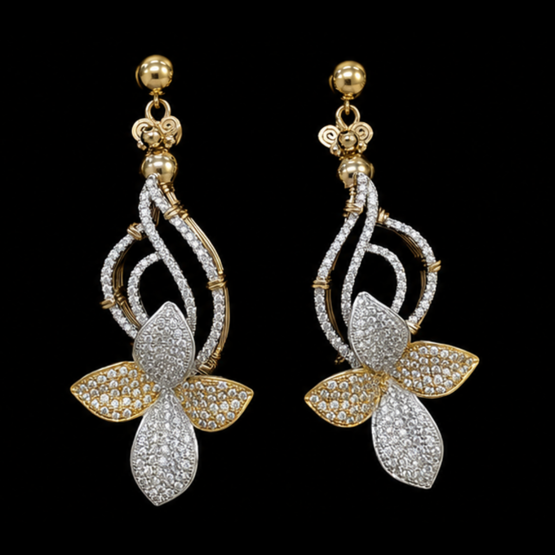 Gold and silver dangling earrings with diamond accents, designed in the shape of a floral or leaf pattern, displayed against a black background.