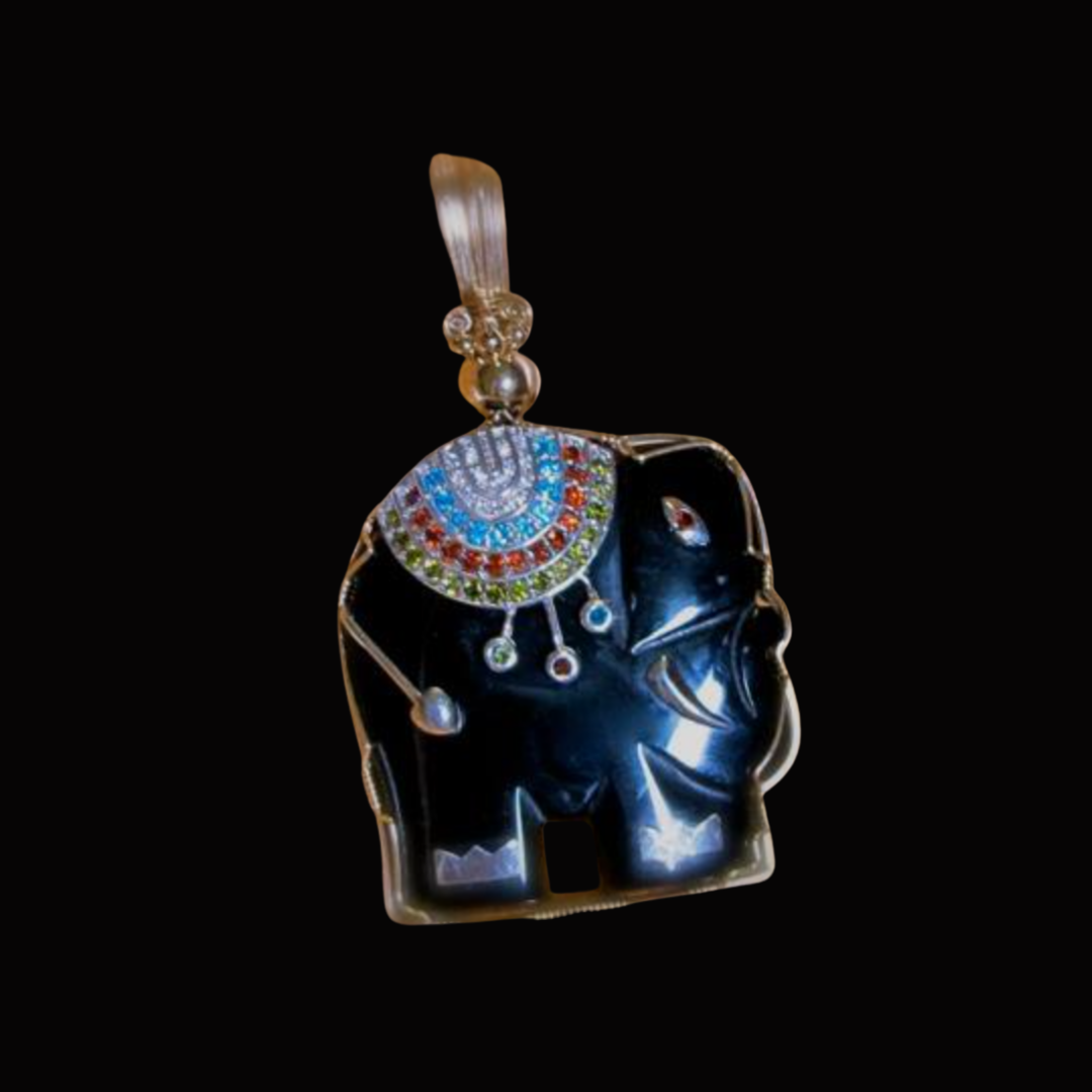 Pendant featuring a silver elephant with a decorative and colorful necklace design against a black background.