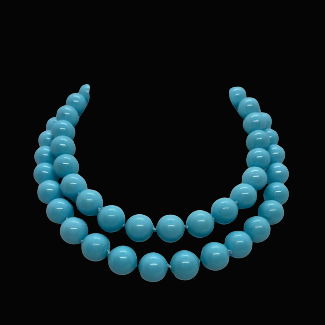 A blue beaded necklace with two strands of round beads on a black background.