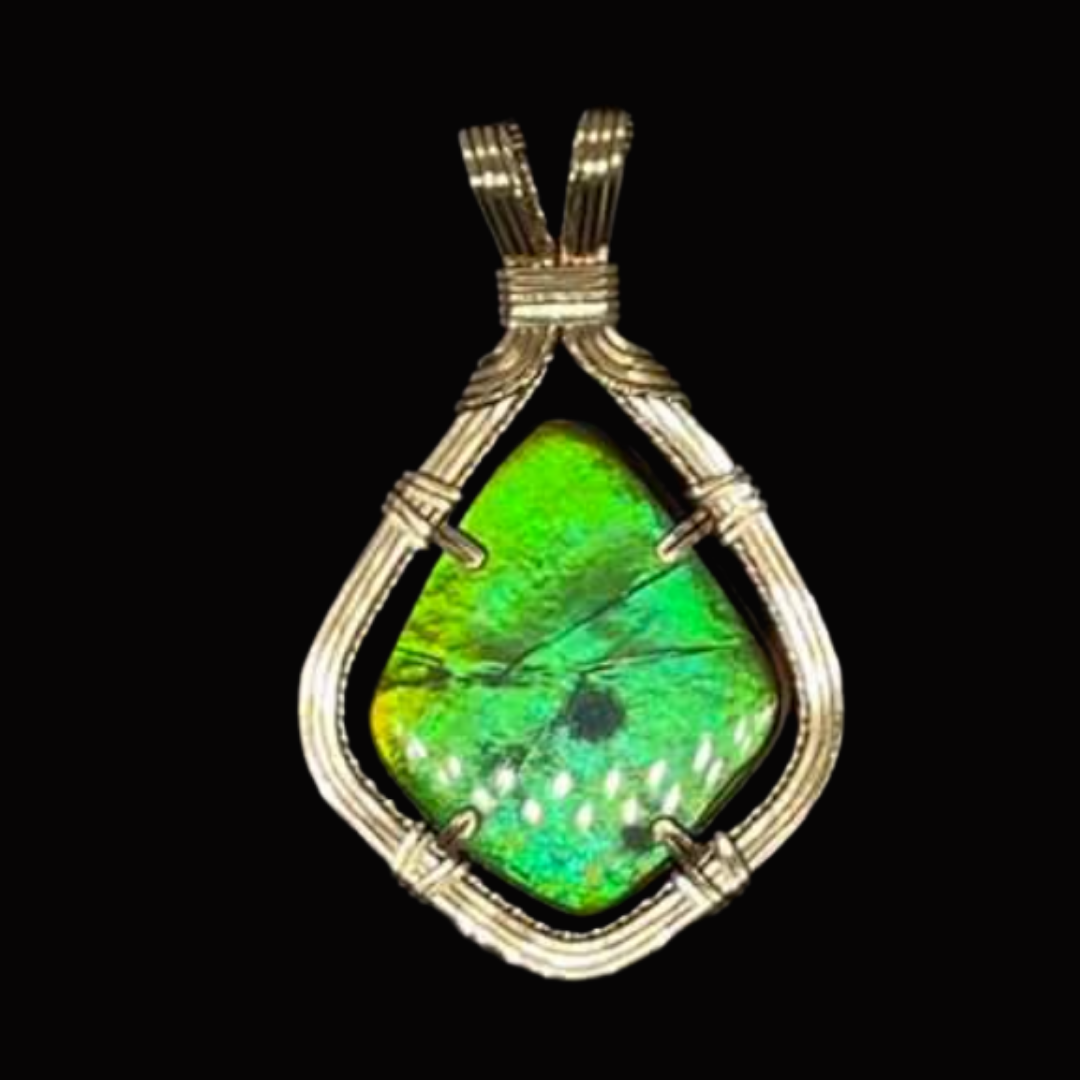Pendant necklace with a large green opal gemstone wrapped in silver wire setting