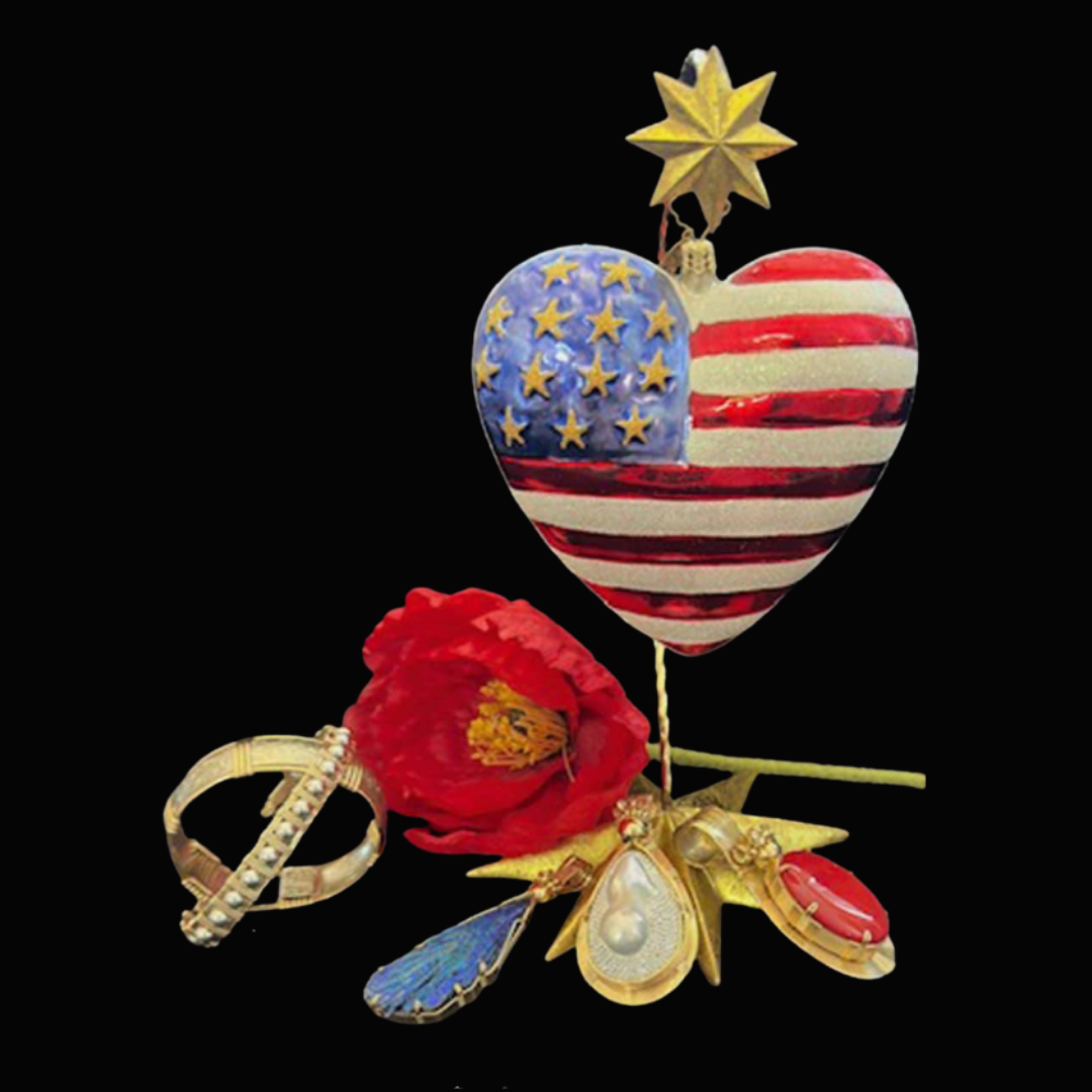 American flag-themed heart-shaped ornament with a star on top, decorative flower, and jewelry items on a black background.