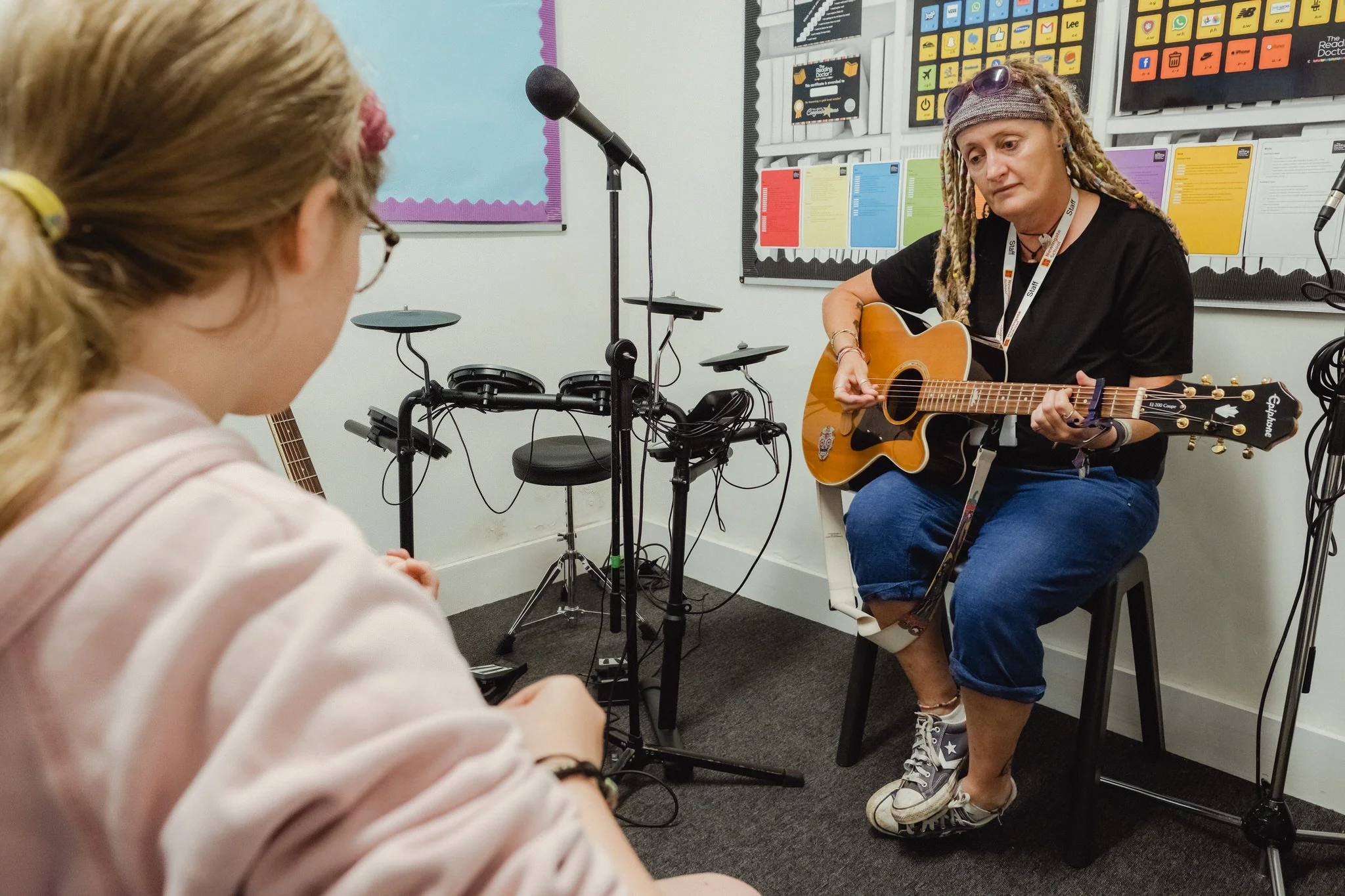 Teacher in a music 1-1 music lesson
