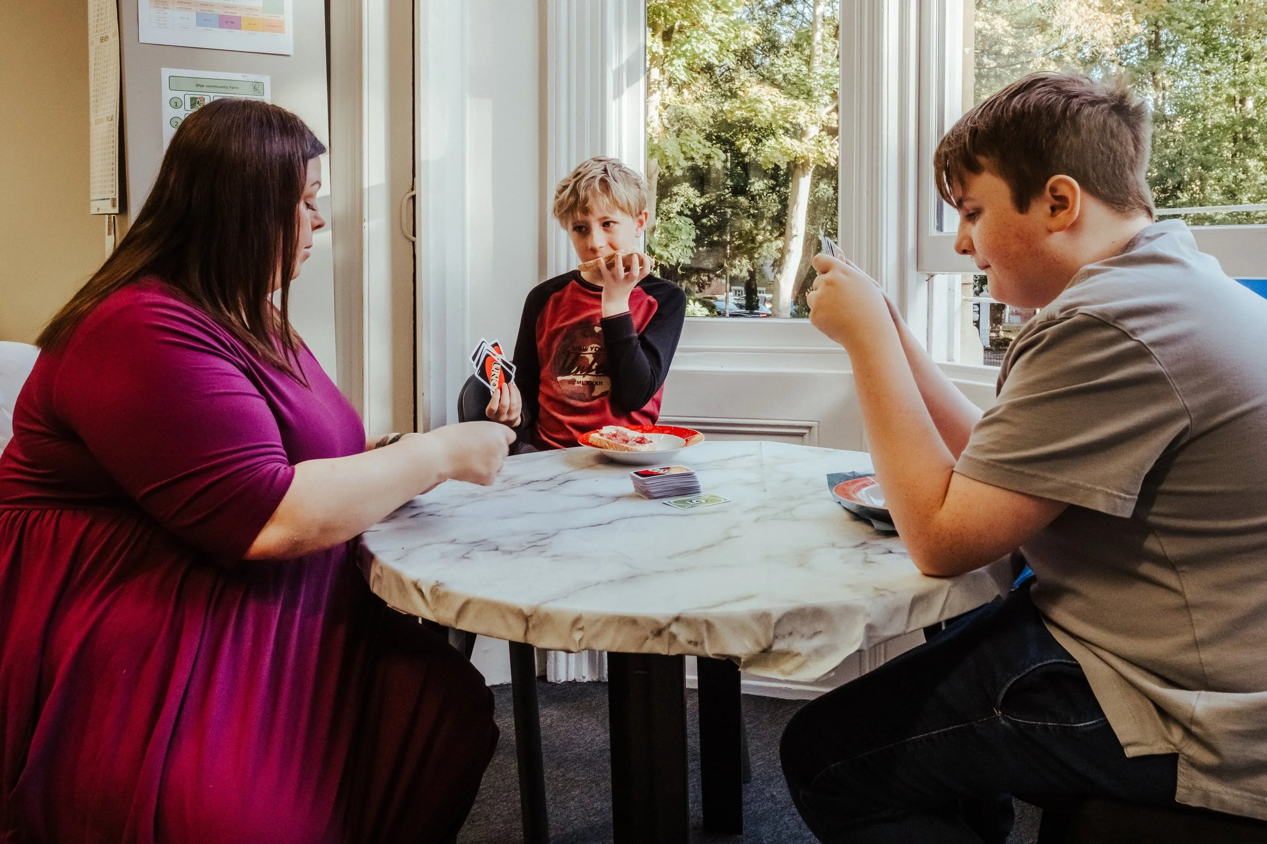 Teacher playing Uno with students