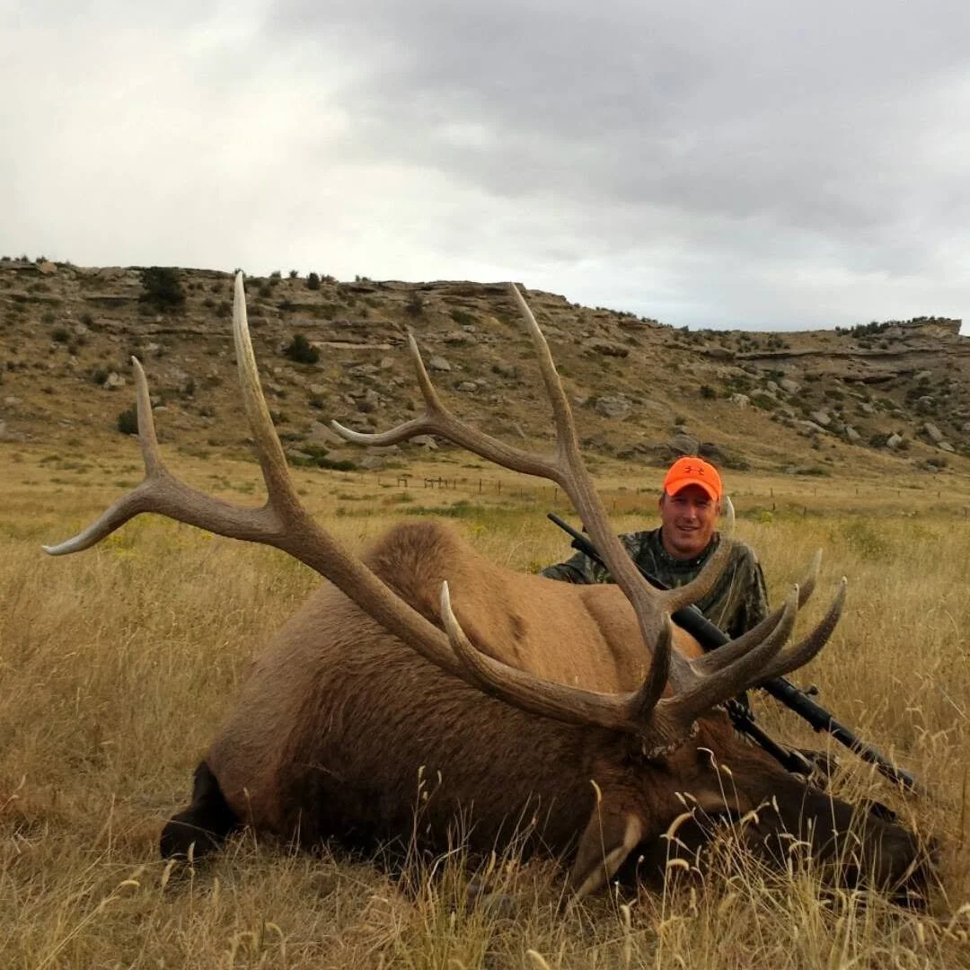 Joe Speckner, candidate for Wyoming House District 5, posing with an elk he's just successfully hunted.