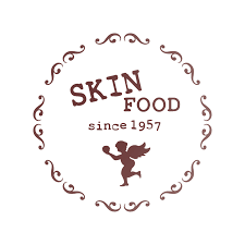 Logo for Skin Food, a company established in 1957, featuring decorative swirls and a dancing figure.