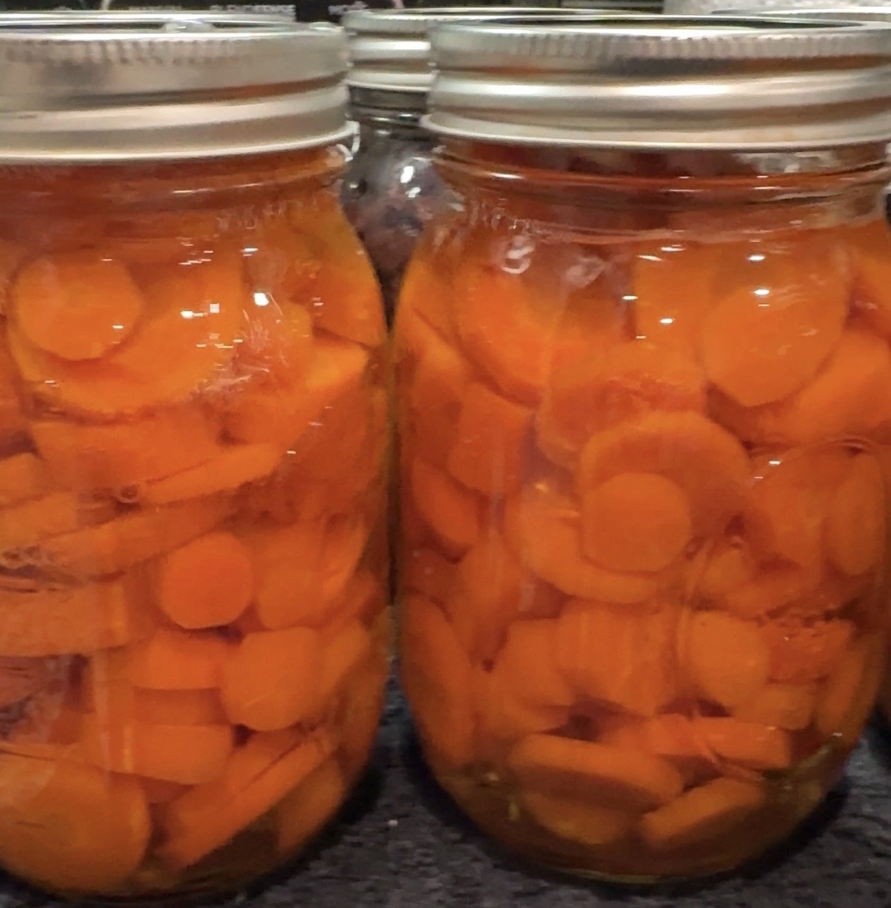 Jars of cooked carrots
