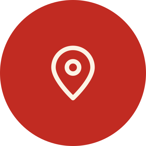 Red circular map marker icon with a white pin inside