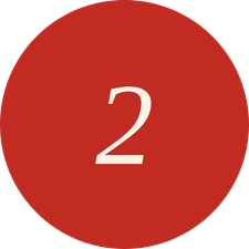 Red circle with the number two in white center