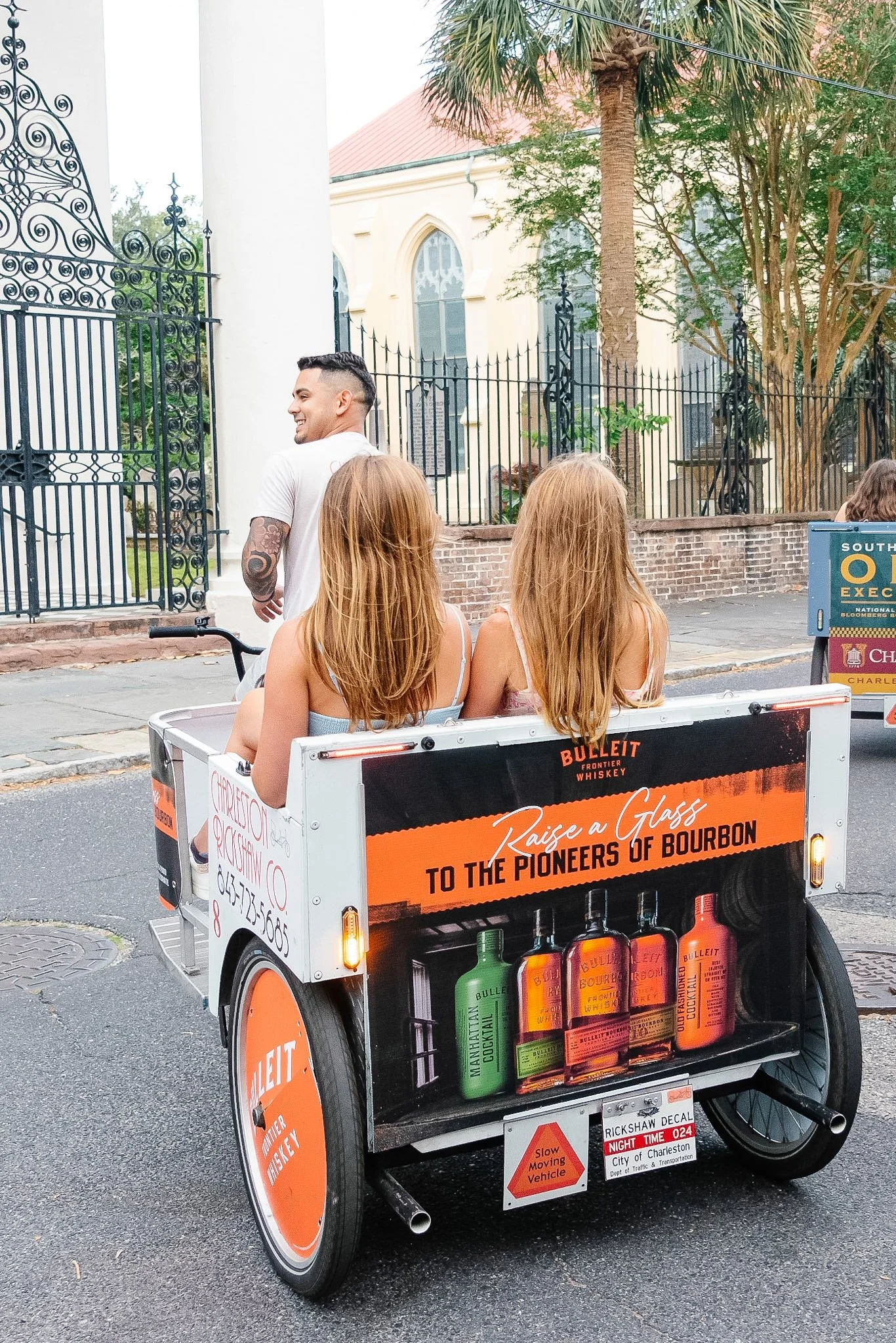 Charleston Rickshaw advertising cart promoting Bulleit Bourbon in downtown Charleston