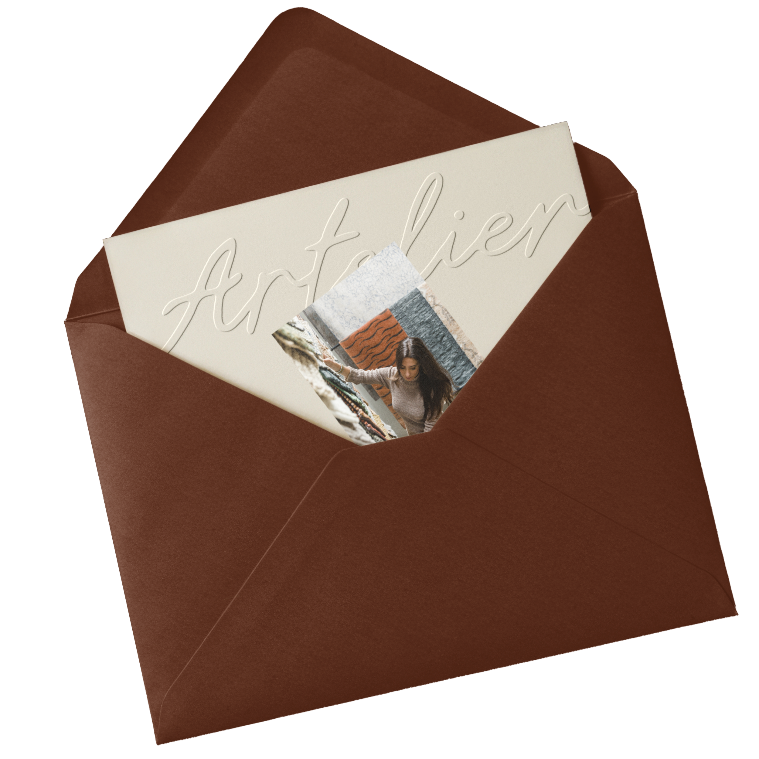Close-up of a greeting card inside a brown paper envelope, with an embossed cursive message partially visible.