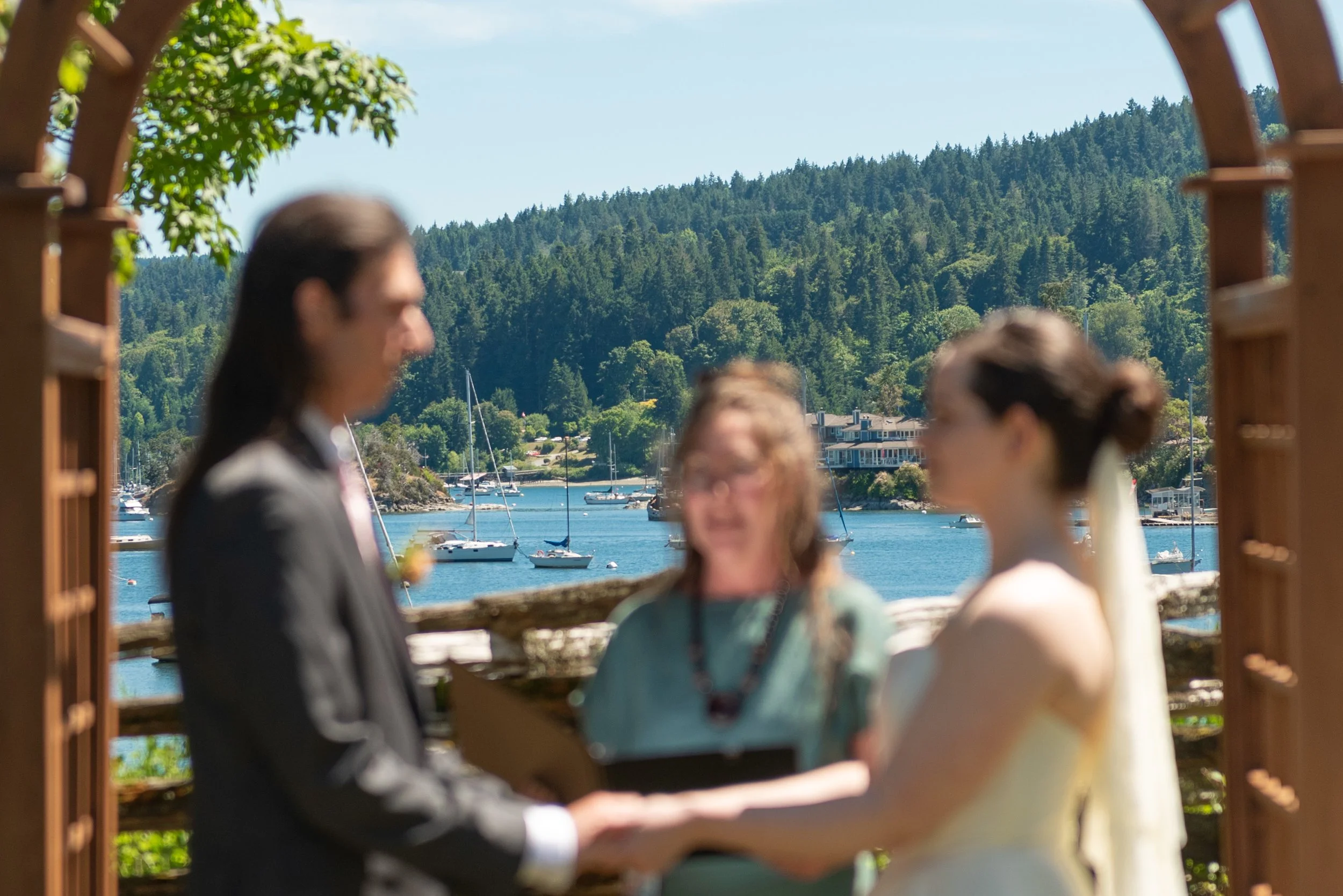 Emily and Yohann walking together during their Hastings House wedding on Salt Spring Island