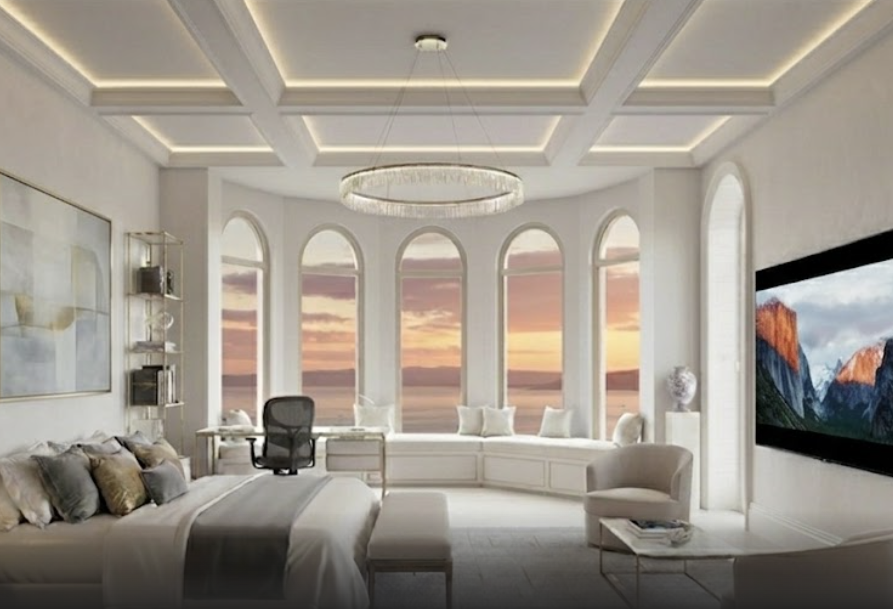 Terra Linda mansion primary suite with a bed, arched windows, sunset bay views, a window seat, desk, and wall-mounted screen.