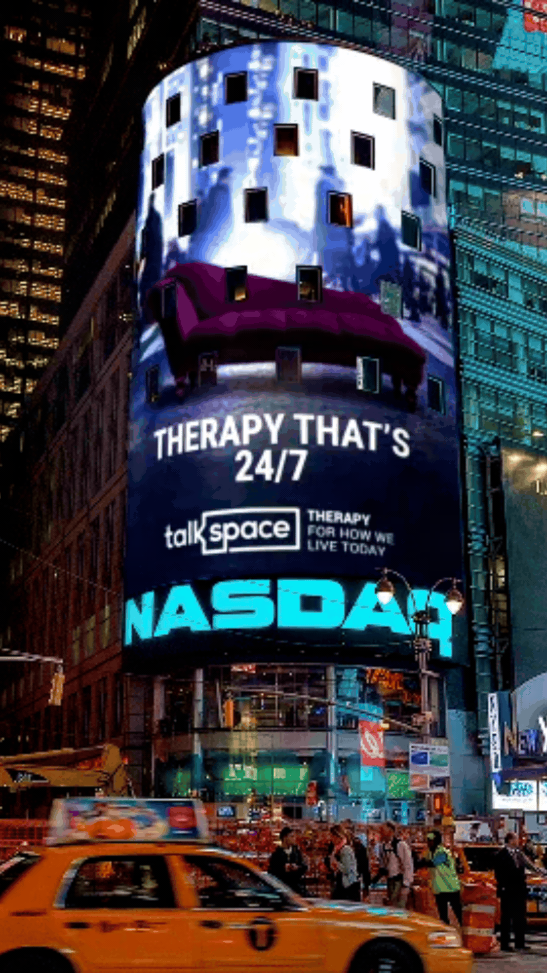 Bright digital billboard in Times Square displaying an advertisement for talkspace, a 24/7 therapy service, with a futuristic cityscape background and the Nasdaq logo at the bottom, surrounded by pedestrians and yellow taxis.