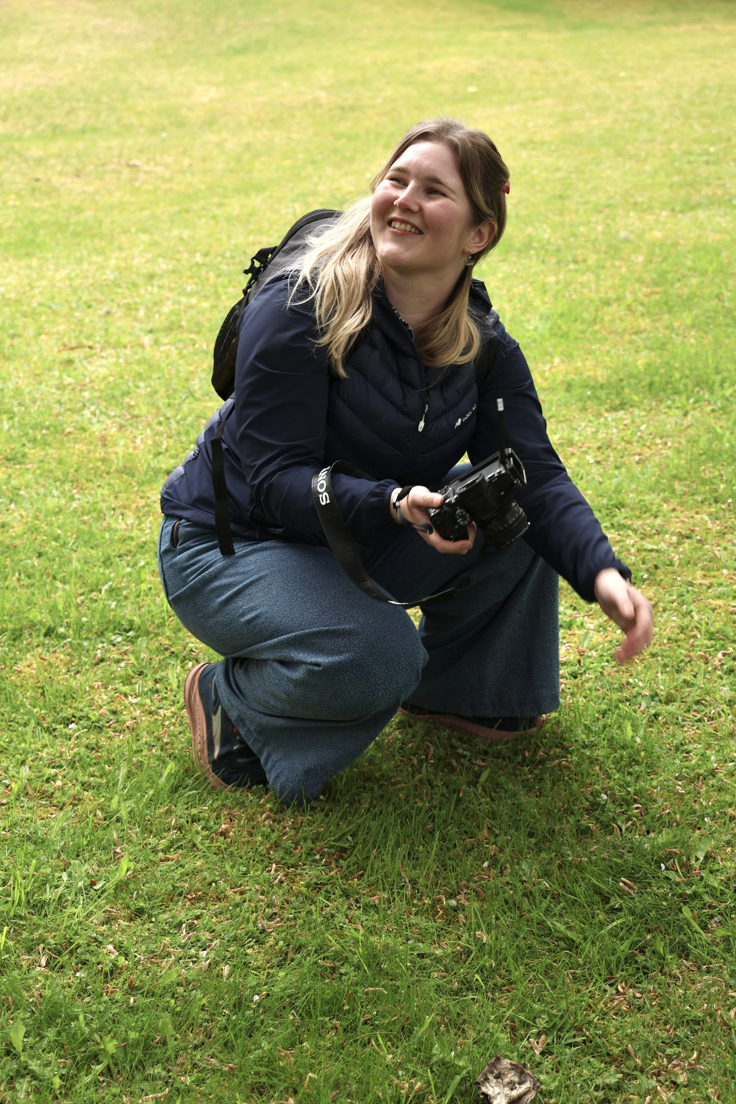 A portrait of Louise Took Photography smiling while hard at work - photo taken by Marie at Smith Wild Photo