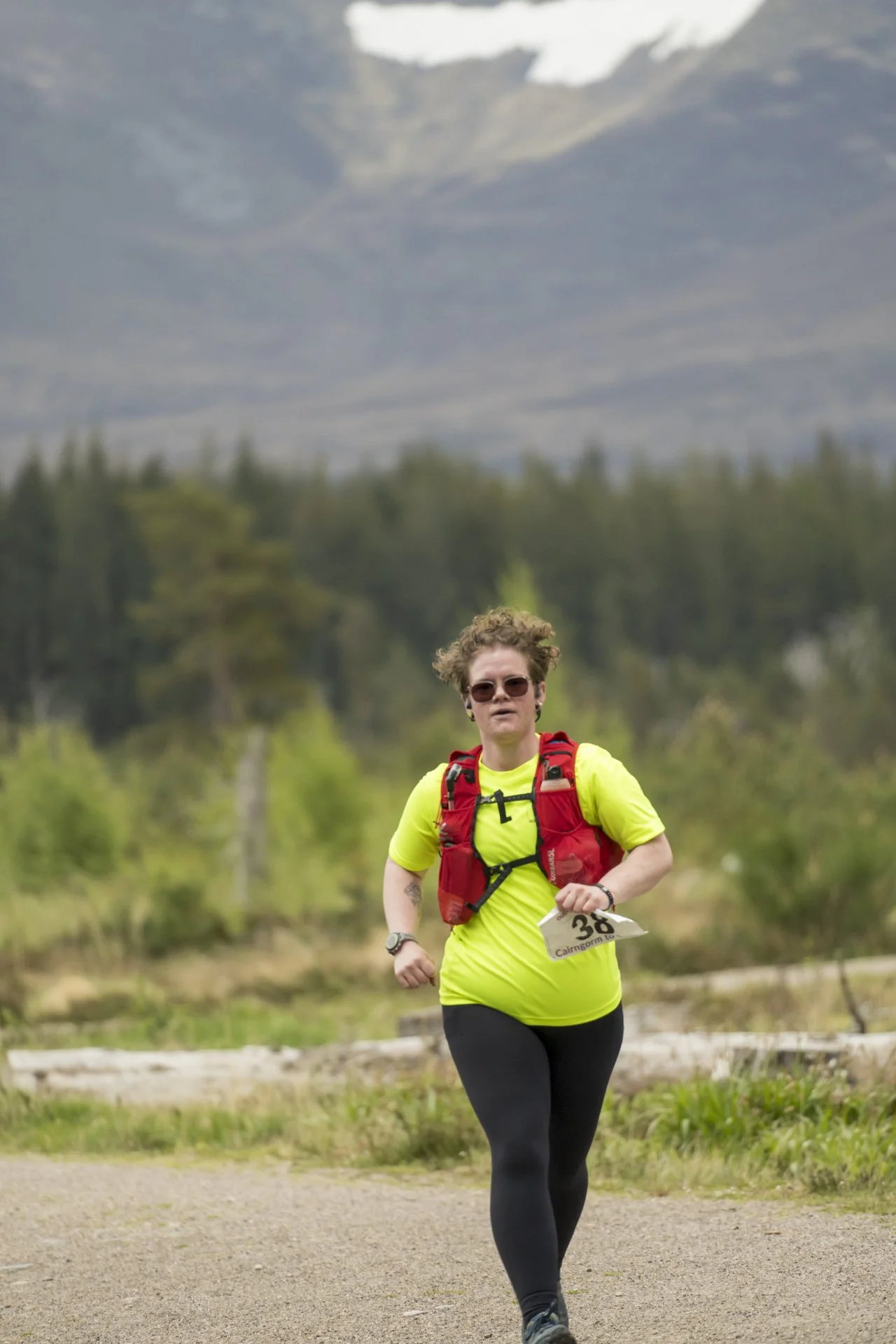 Candid and professional race photography in the north of Scotland showing a participant running in an ultra race through the Cairngorms National Park in the Highlands