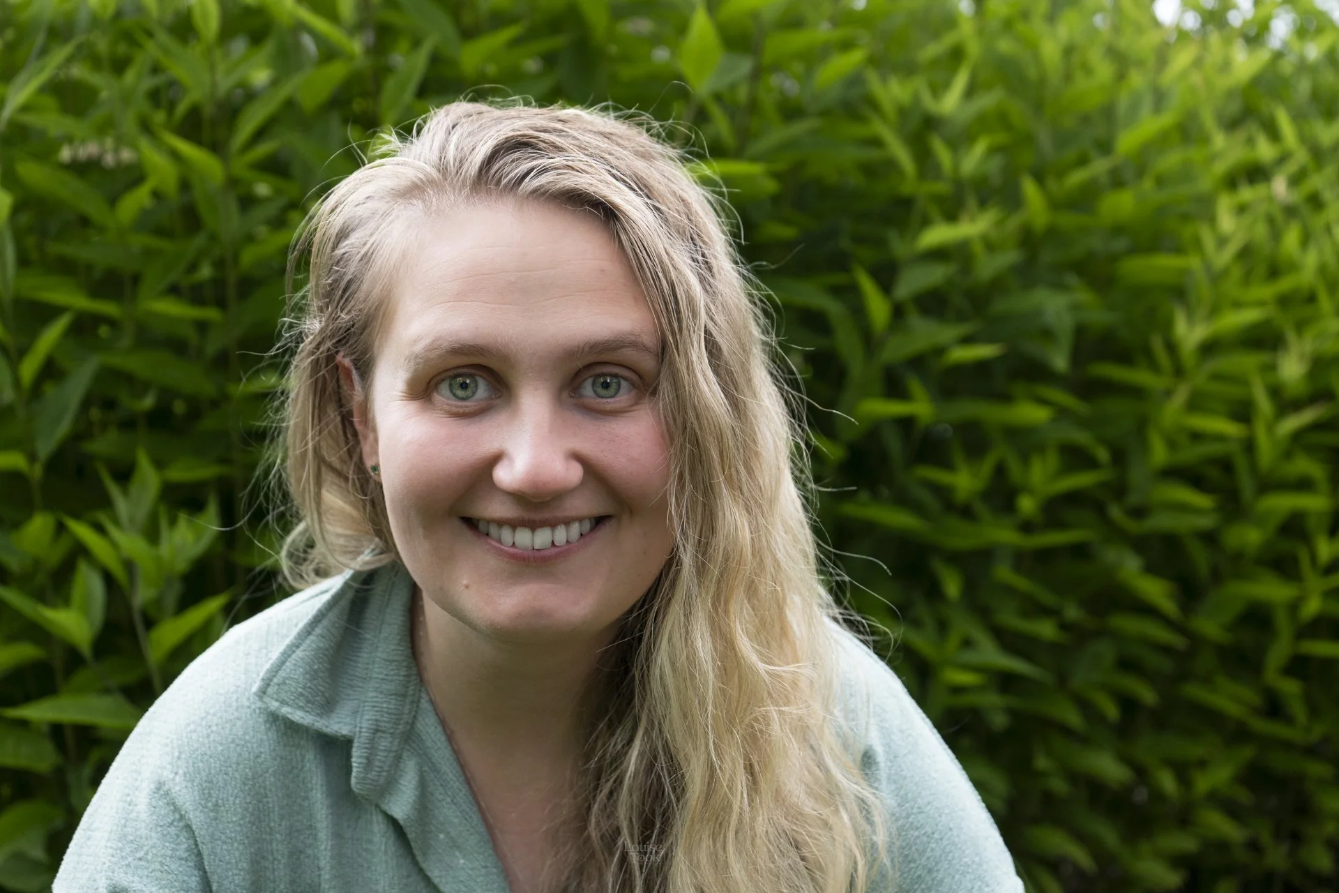 Relaxed outdoor portrait of a young women who is relaxed and happy in Speyside