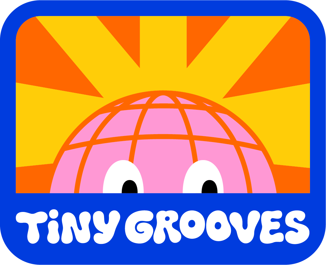 A colorful logo for Tiny Grooves featuring a pink globe with eyes and orange grid lines on a yellow and orange background. The text "Tiny Grooves" is written in white, rounded letters at the bottom.