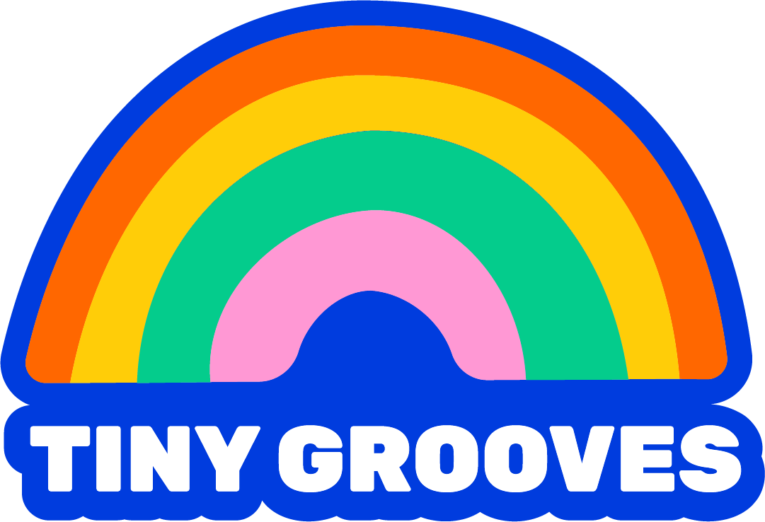 Colorful rainbow with the words "Tiny Grooves" written below it