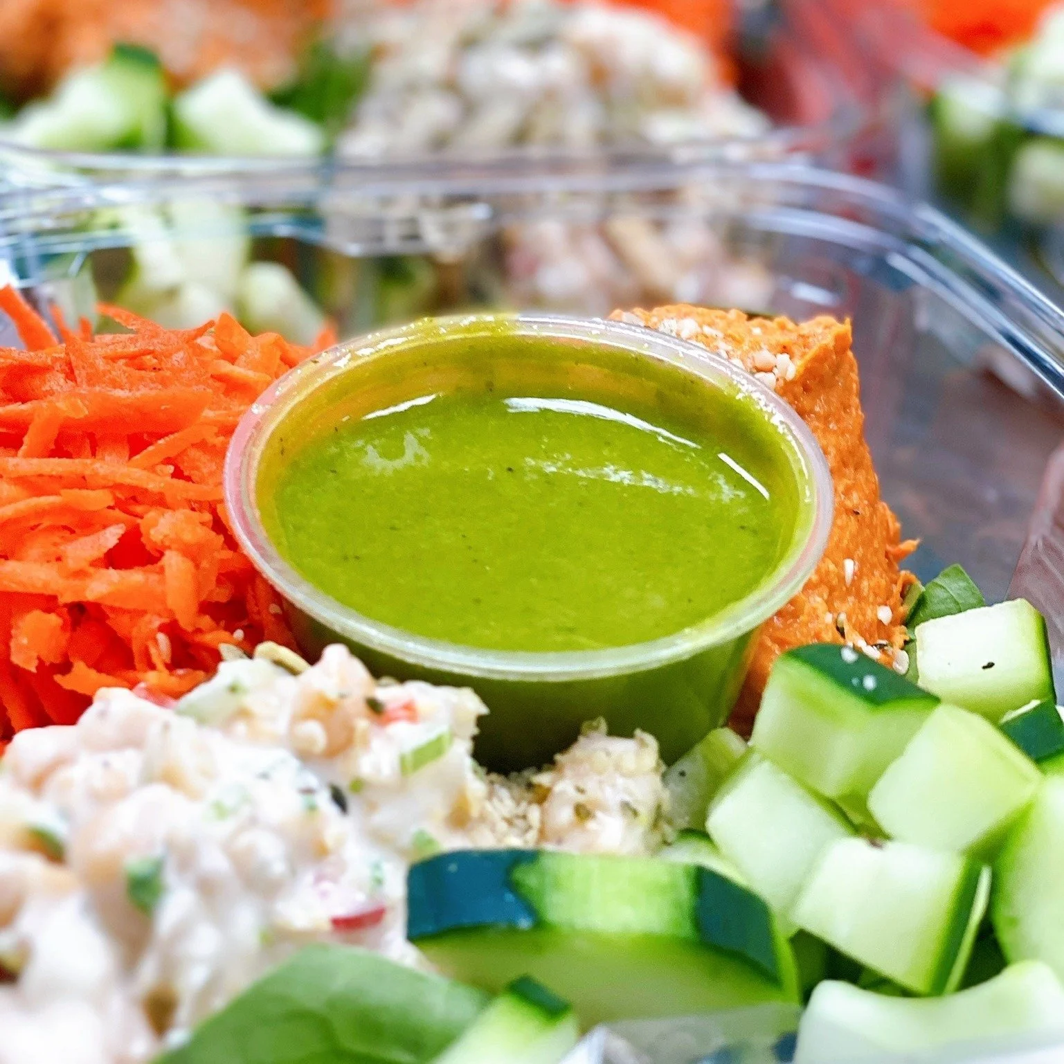 Fresh organic salad and bowl catering spread with green dressing, Green Fork & Straw