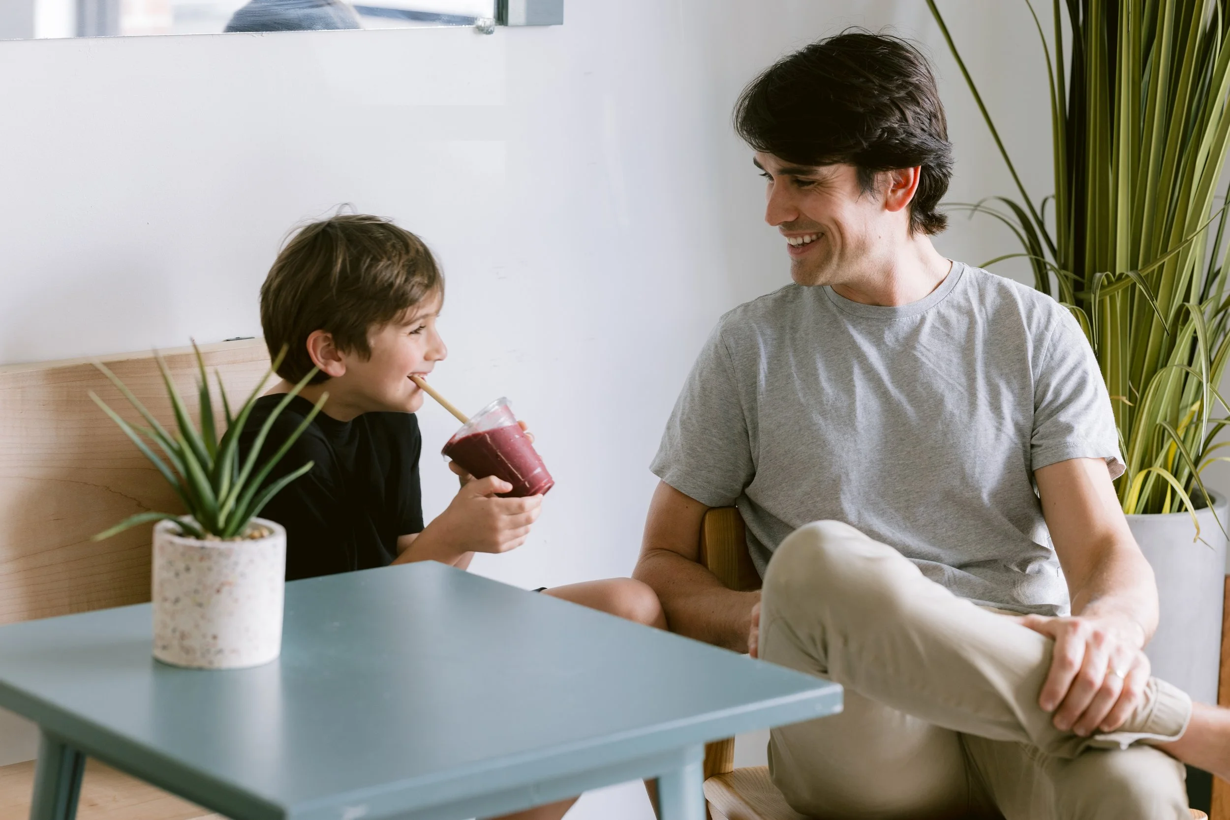 Father and son enjoying organic meal prep from Green Fork & Straw