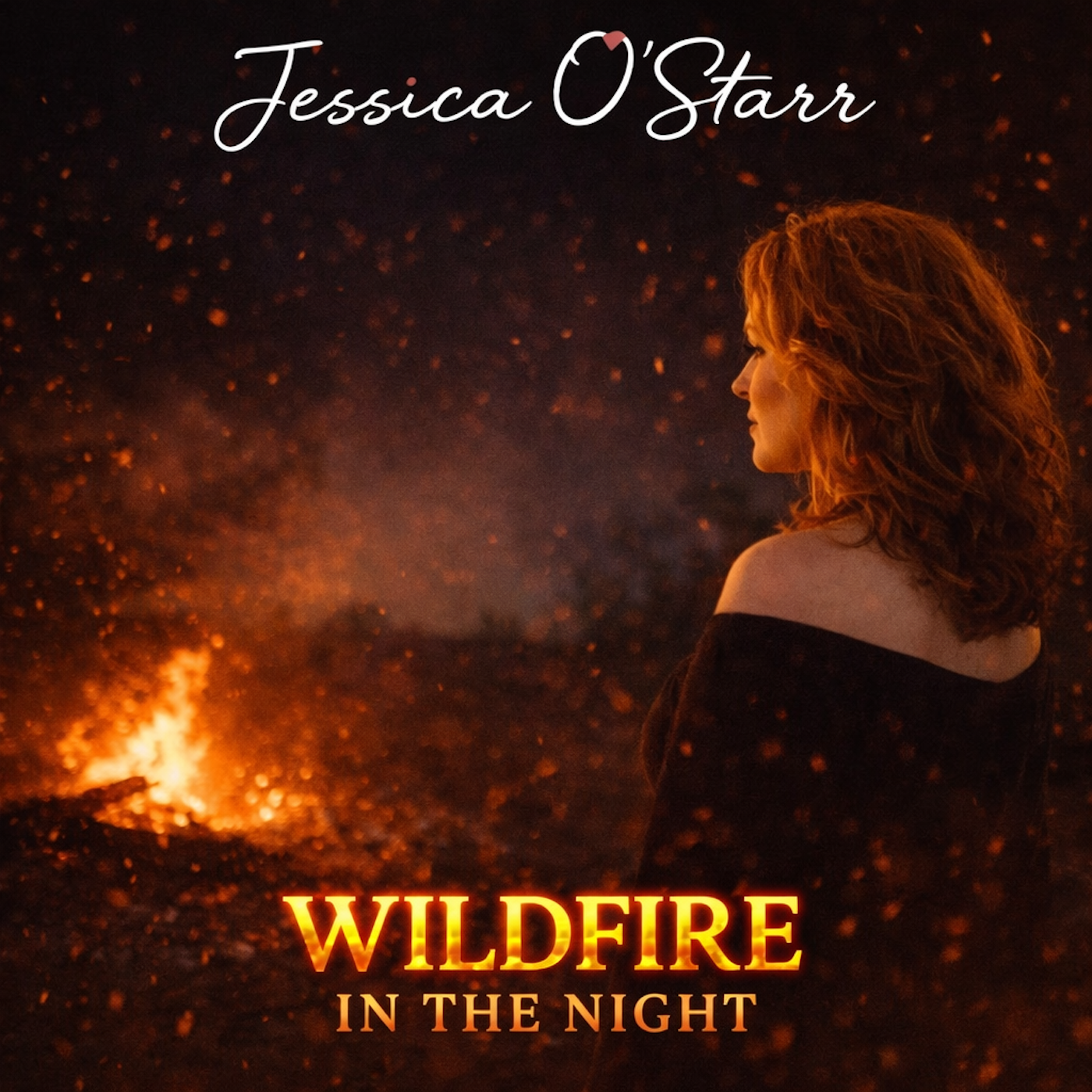 A woman with wavy red hair looking at a fiery outdoor scene with glowing embers and sparks, with the title 'Wildfire in the Night' and the author's name 'Jessica O'Starr' at the top.