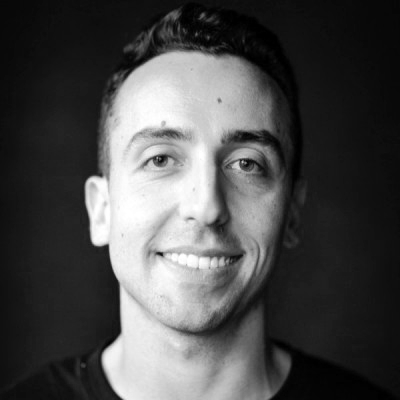 Black and white headshot of Cem Kansu Chief of Product at Duolingo