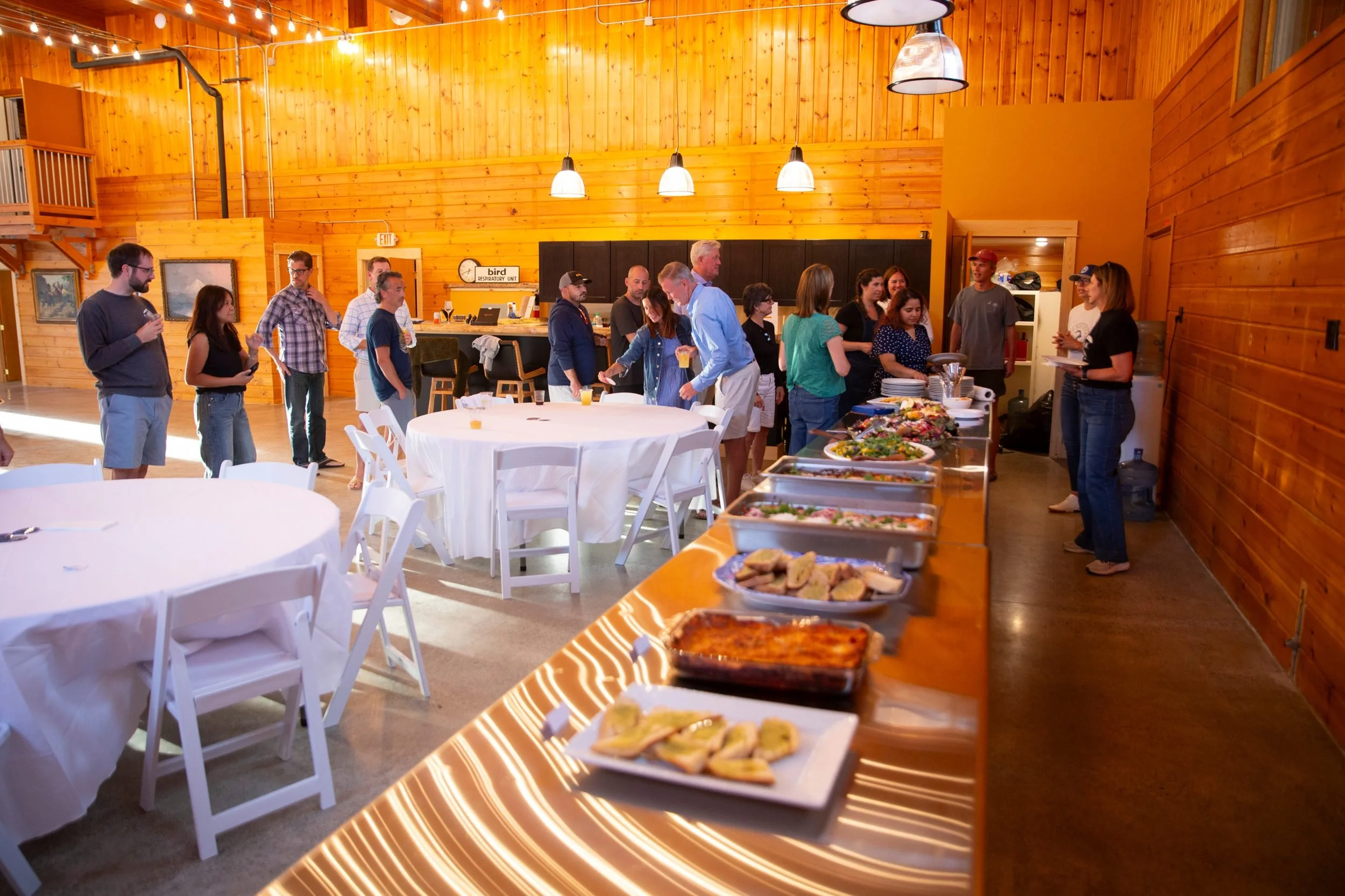 Guests at a buffet dinner in the lodge at The Retreat on Lake Pend Oreille in Sagle, Idaho
