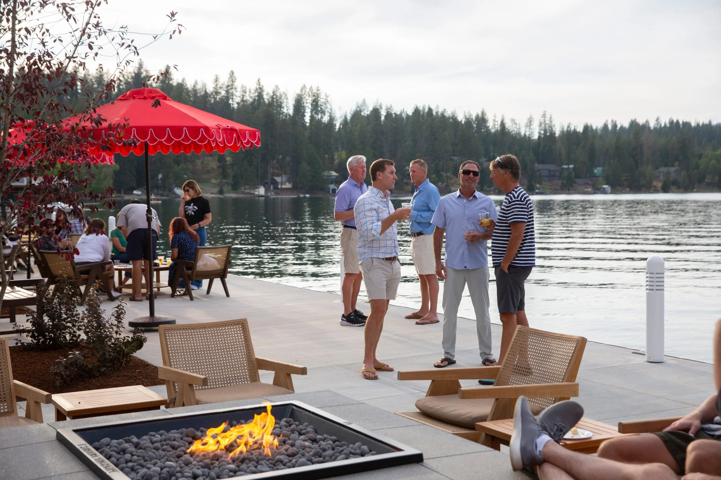 Guests gathered on the lakefront patio at The Retreat on Lake Pend Oreille in Sagle, Idaho