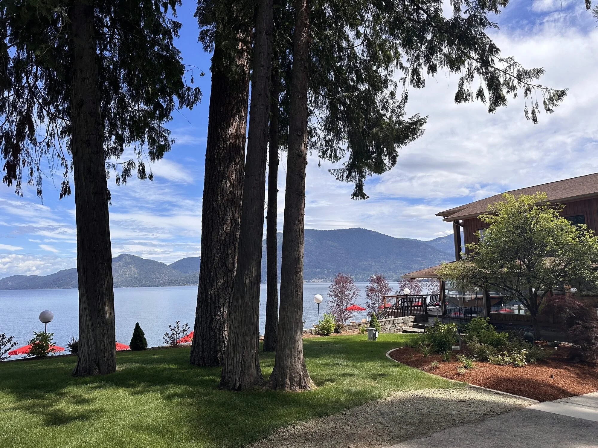 Red umbrellas on the deck above Lake Pend Oreille in Sagle, Idaho