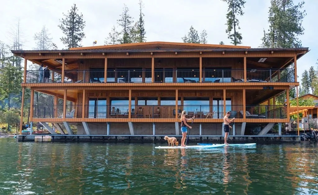 Paddleboarding past the lodge on Lake Pend Oreille in Sagle, Idaho