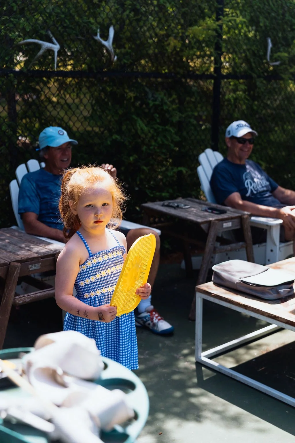 A young guest holding a pickleball paddle at The Retreat on Lake Pend Oreille in Sagle, Idaho