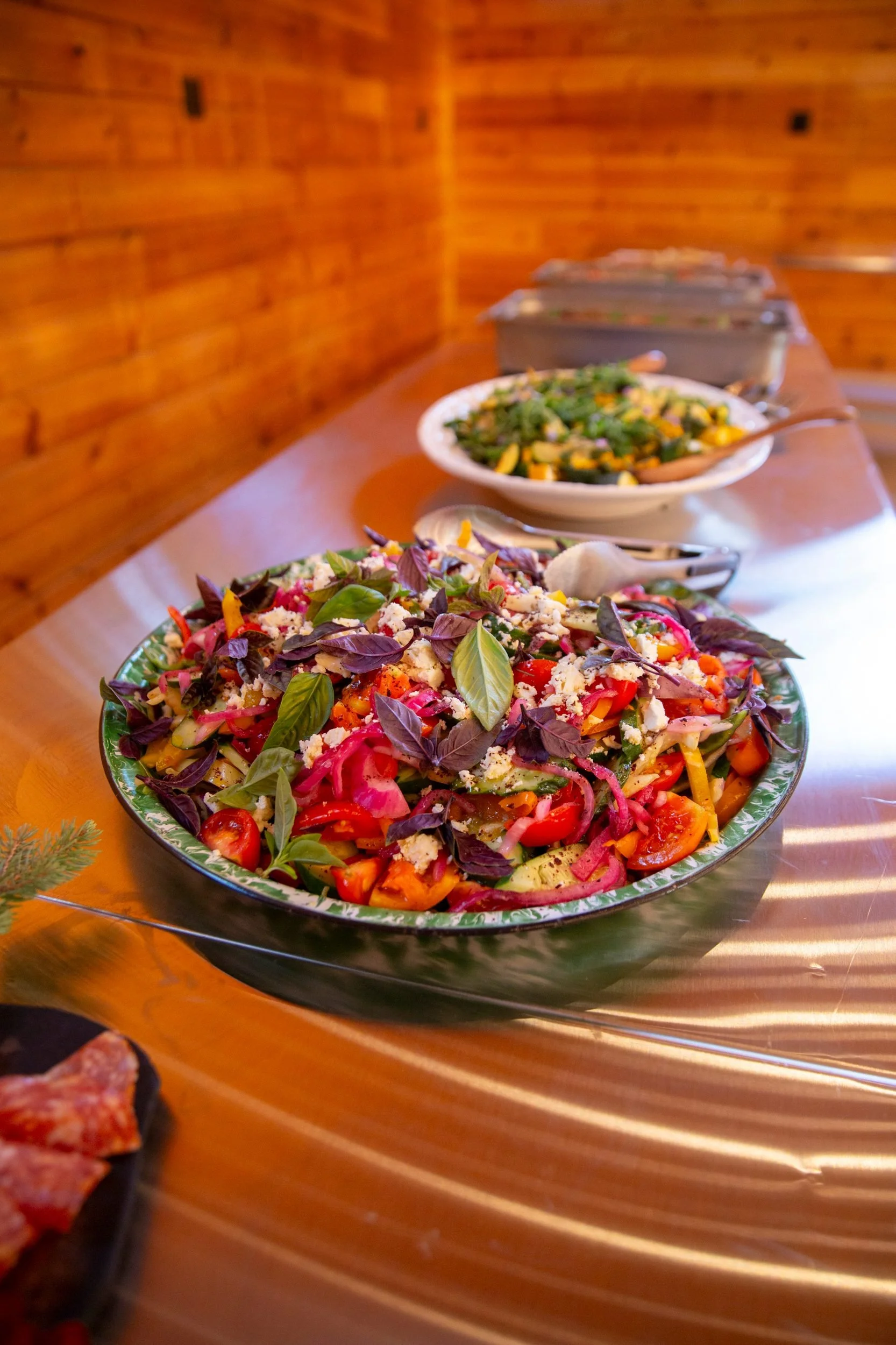 A fresh salad on the buffet at a catered gathering at The Retreat on Lake Pend Oreille