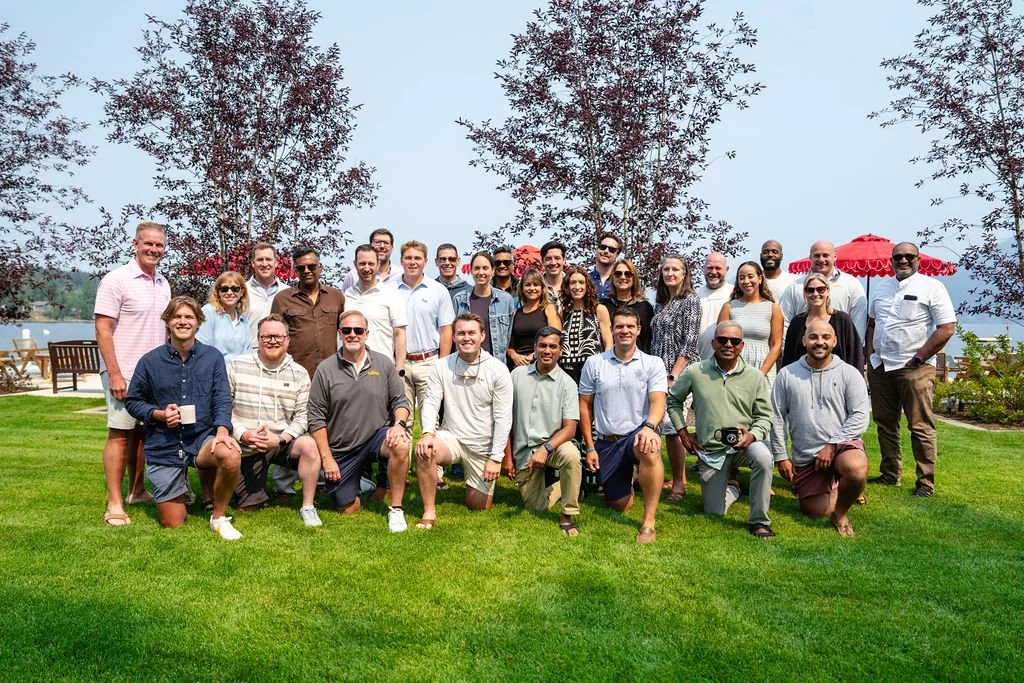 the-retreat-lake-pend-oreille-corporate-retreat-group-photo-lakefront-lawn.jpg
