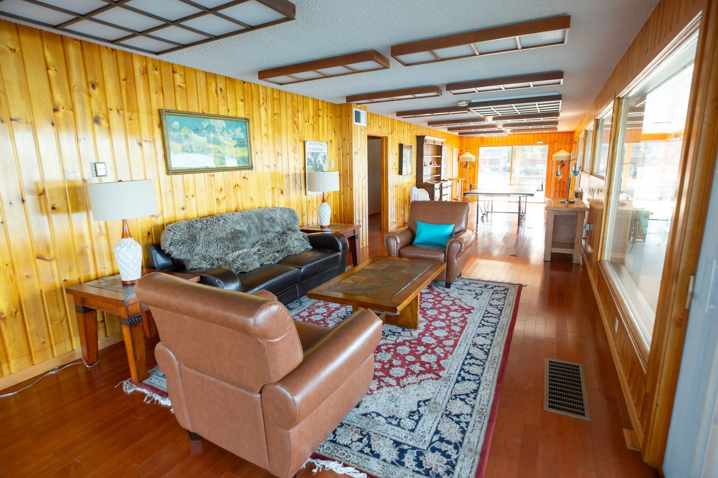 Armchairs and lake views in the great room at The Retreat on Lake Pend Oreille