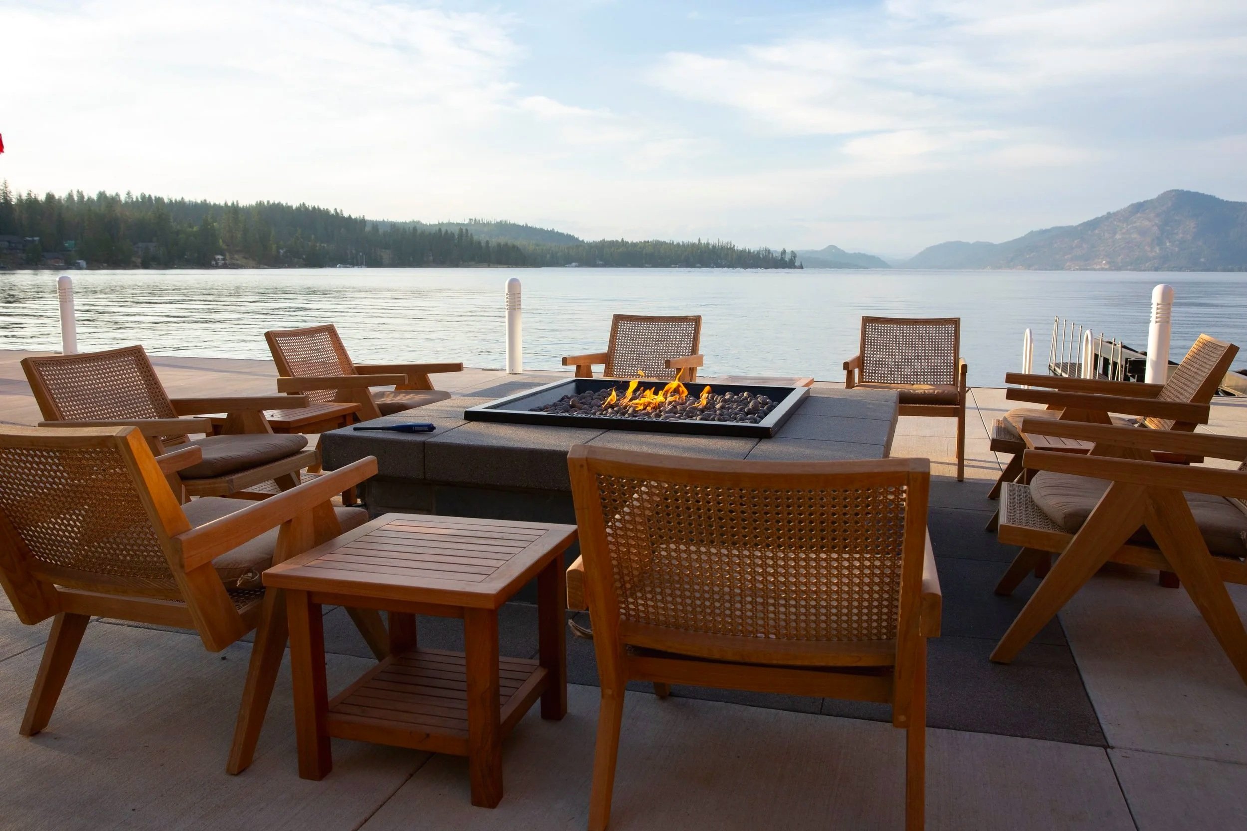 The lakeside fire pit ringed with chairs at The Retreat on Lake Pend Oreille