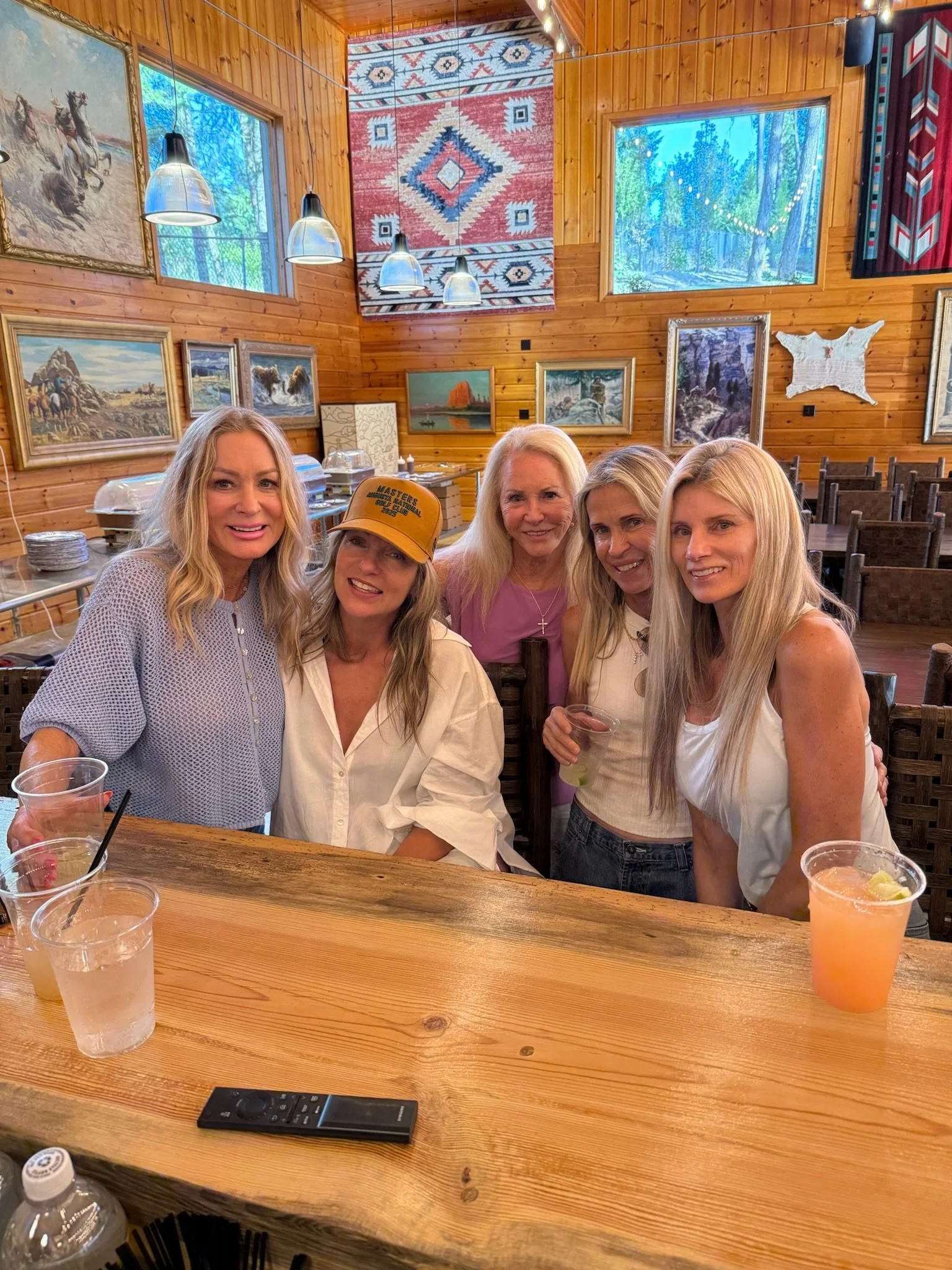 Friends gathered around a table at the bar inside The Retreat on Lake Pend Oreille in Sagle, Idaho