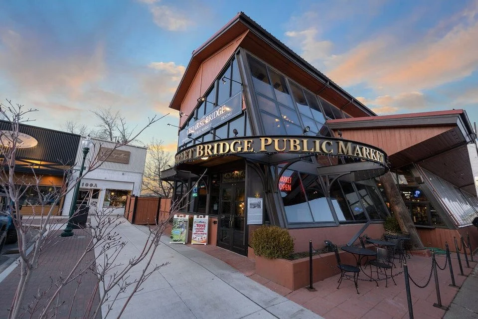 Cedar Street Bridge Public Market at sunset in downtown Sandpoint, Idaho, twenty-five minutes from The Retreat on Lake Pend Oreille