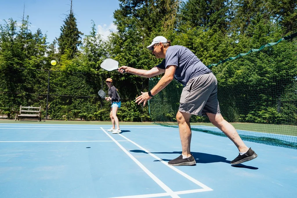 A guest serving during a pickleball match at The Retreat on Lake Pend Oreille in Sagle, Idaho