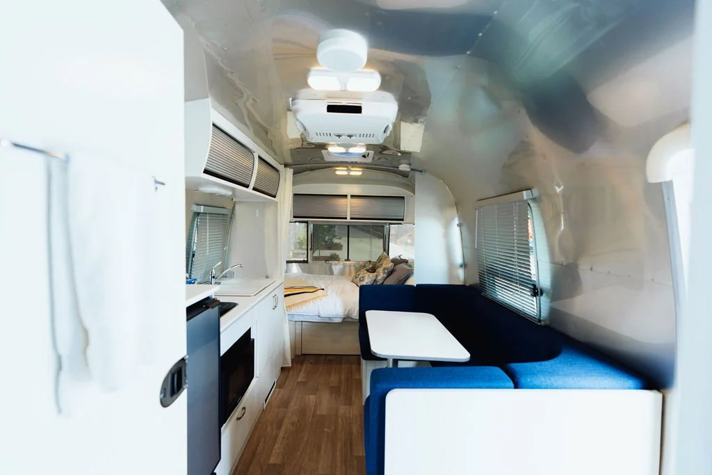 05-the-retreat-lake-pend-oreille-the-lab-airstream-interior-blue-lounge.jpg