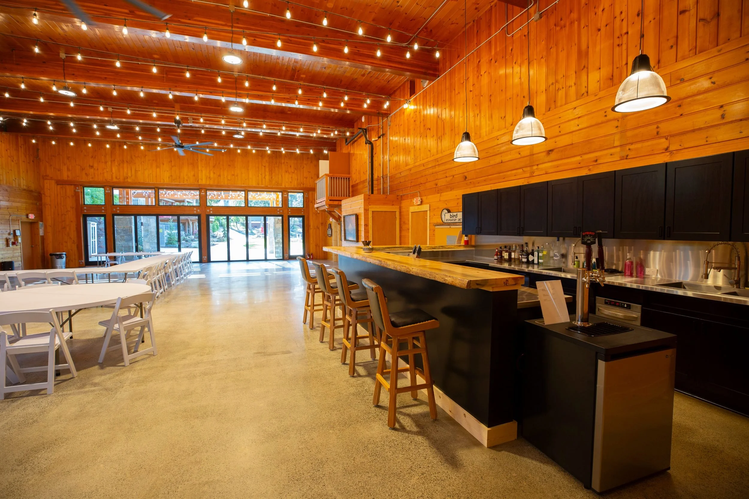 The event hall with floor-to-ceiling windows at The Retreat on Lake Pend Oreille