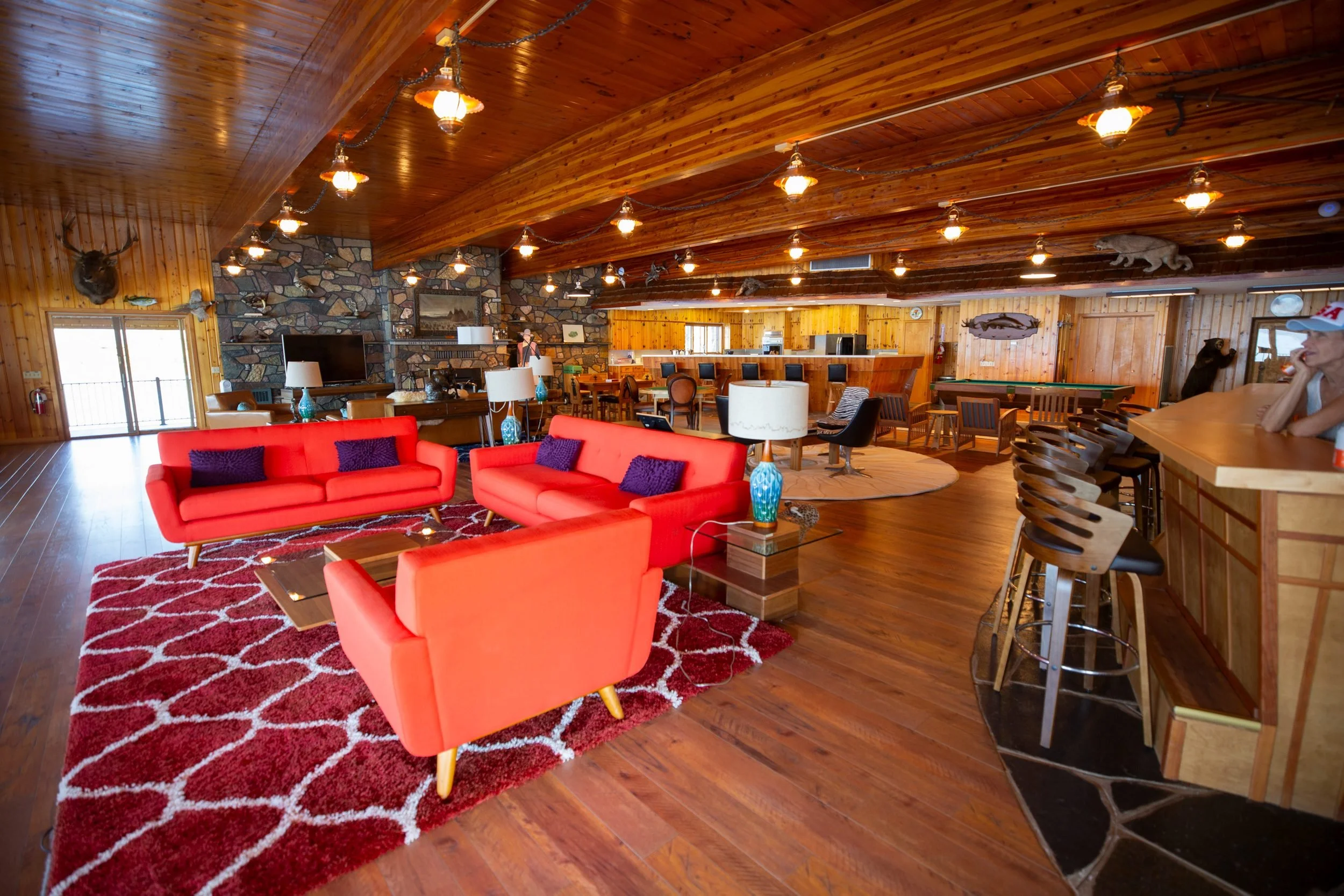 The great room and stone fireplace at The Retreat on Lake Pend Oreille in Sagle, Idaho