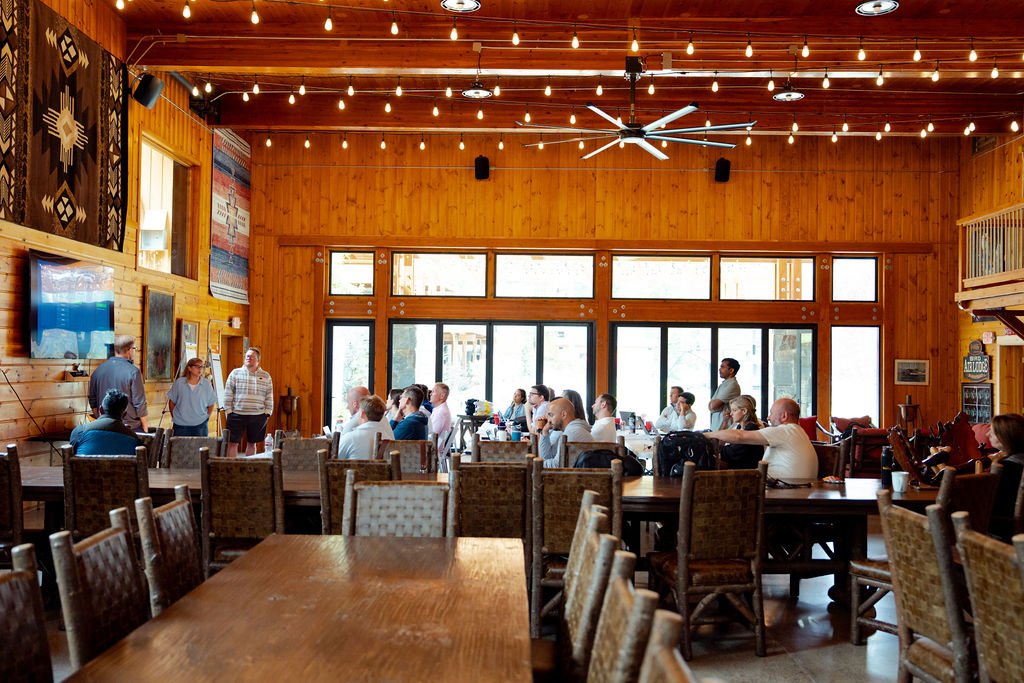 the-retreat-lake-pend-oreille-lodge-dining-hall-shared-meal-tables.jpg