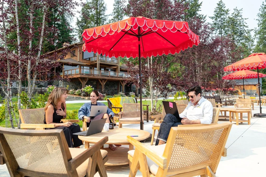 the-retreat-lake-pend-oreille-outdoor-lounge-red-umbrellas-guests.jpg