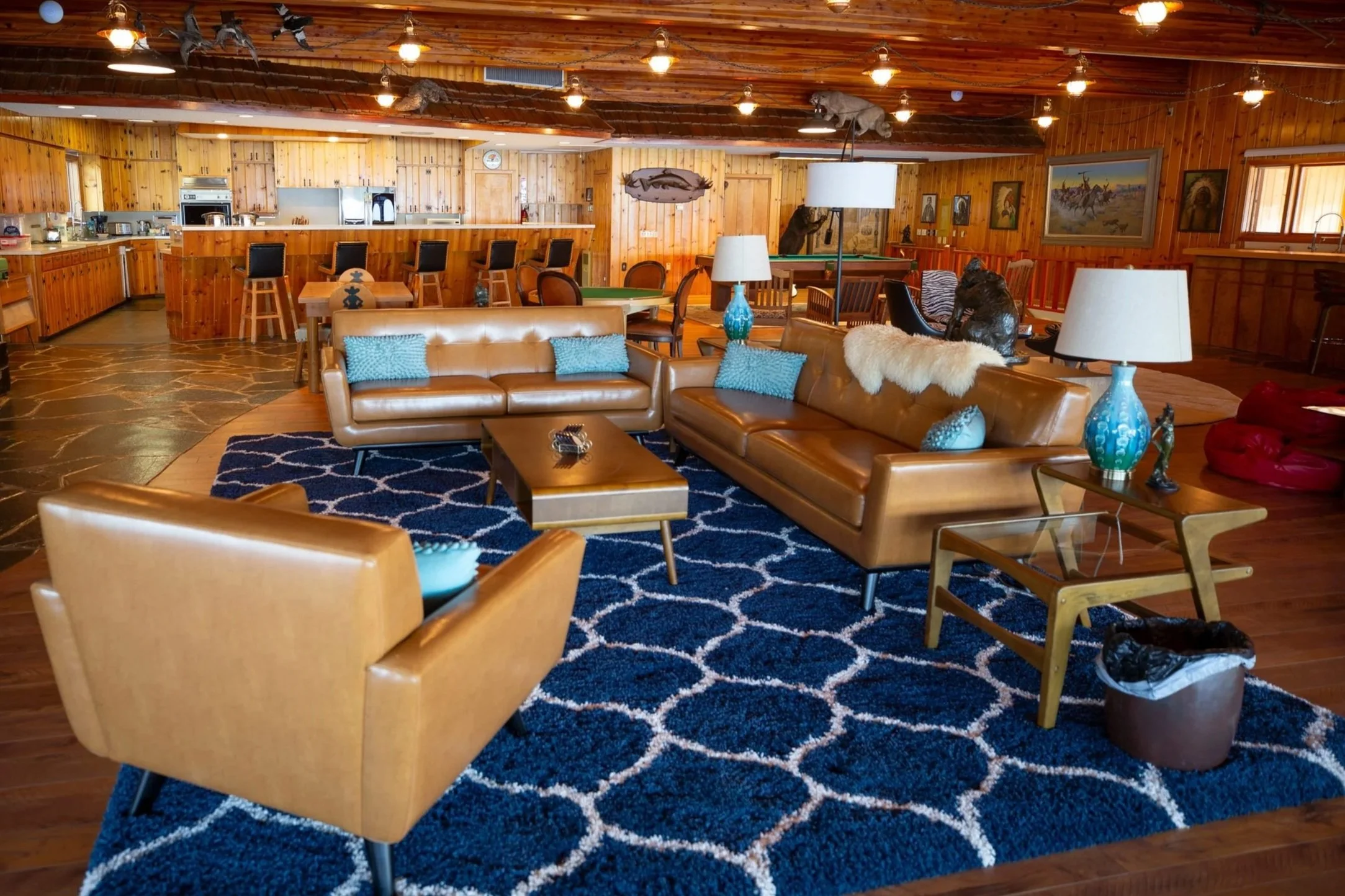 Wood-paneled lodge lounge with leather seating at The Retreat on Lake Pend Oreille in Sagle, Idaho