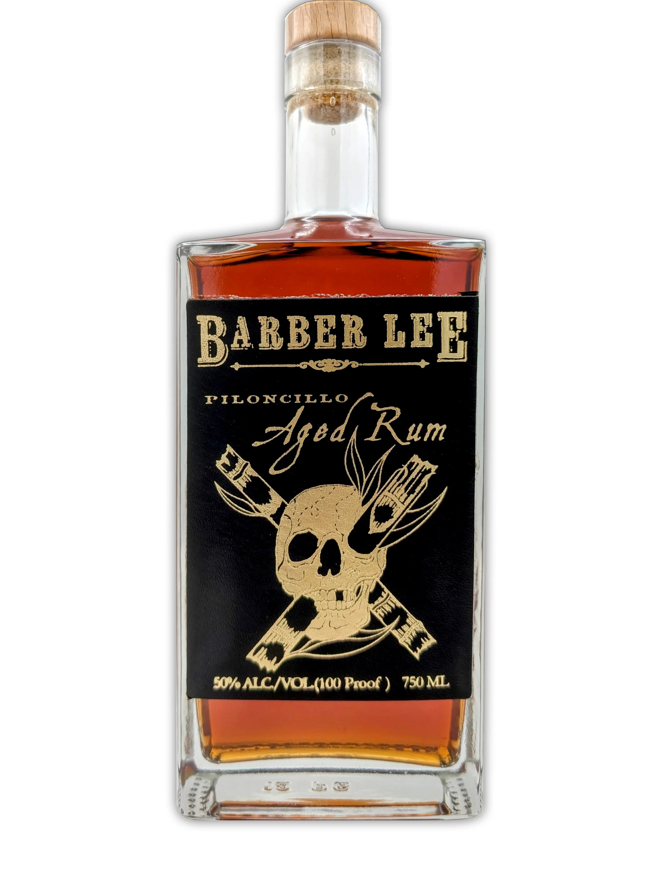 A bottle of Barber Lee aged rum with a black label featuring a gold skull and crossbones design, and details about alcohol content and volume.