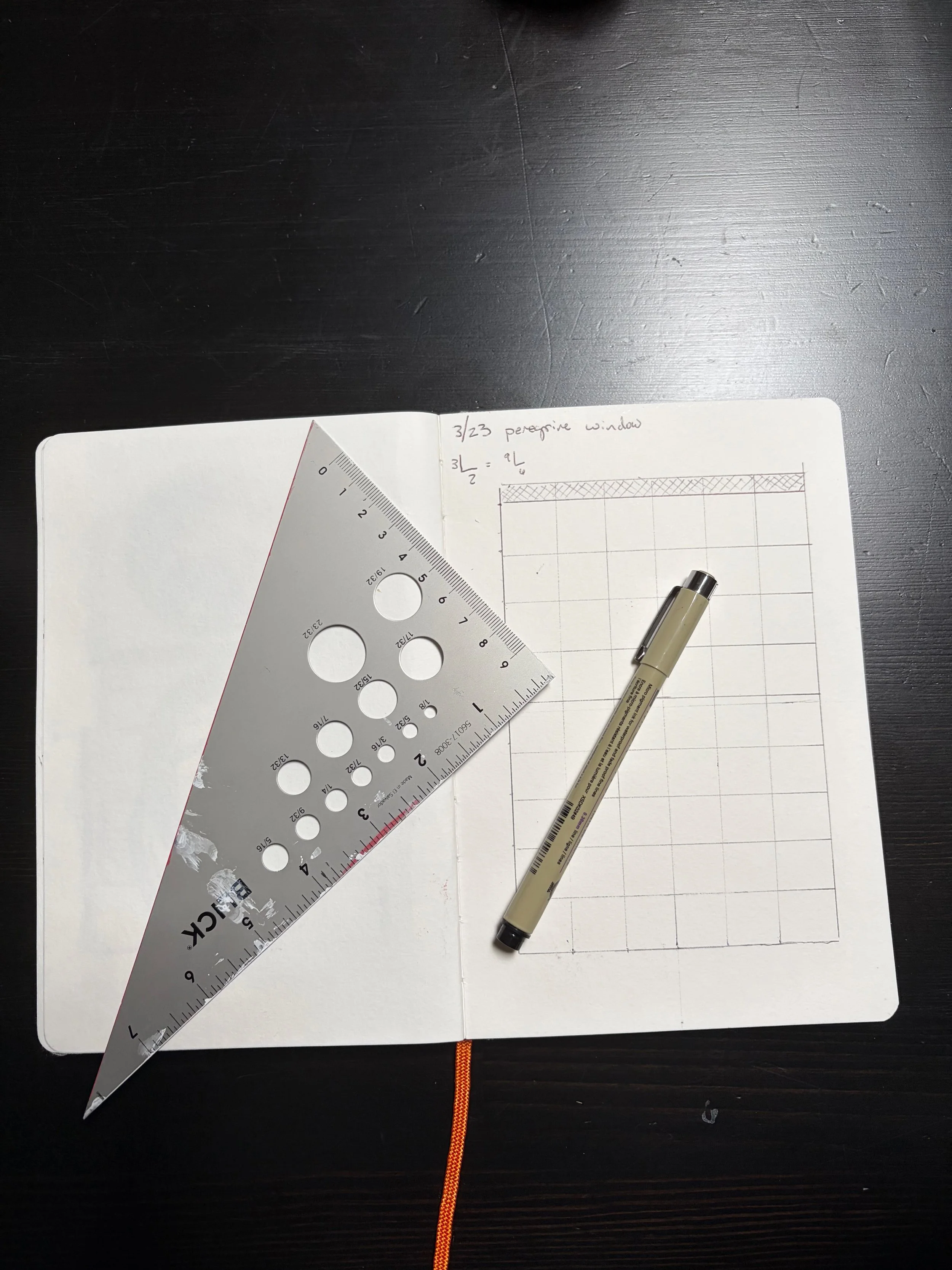 Pen and drawing tools on open notebook