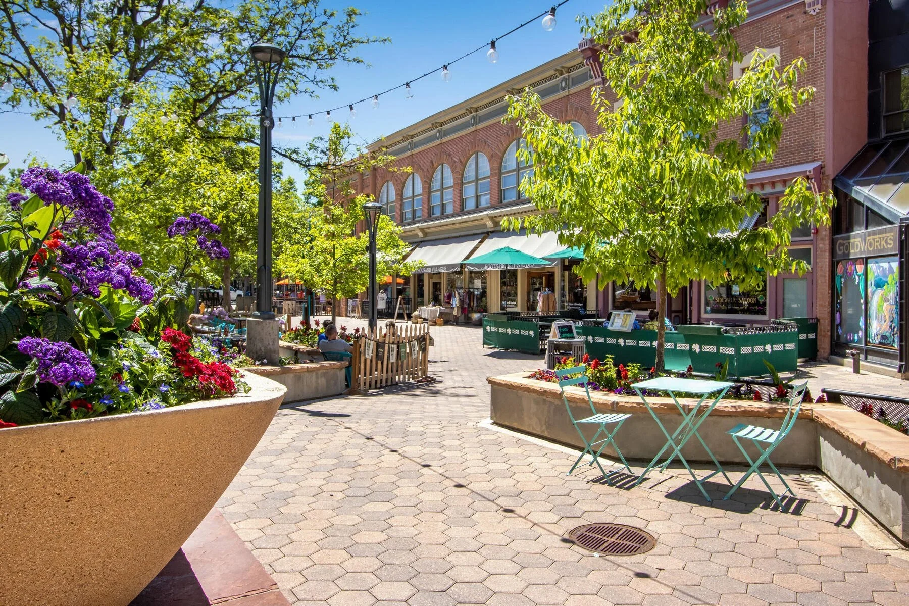 Old Town Square, Fort Collins, at summer evening with people gathering